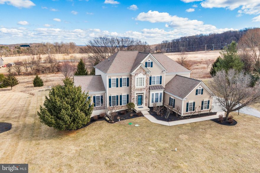 Nestled at the end of a tranquil cul-de-sac in Malvern's esteemed Deerfield neighborhood, 72 Hollow Drive presents a rare opportunity to own a luxurious residence with unobstructed views of protected open space. This 5-bedroom, 4.5-bathroom home, built in 2006, spans approximately 5,370 square feet on a flat, one-acre lot, offering both privacy and serenity. This very special home features three beautifully finished living levels.  The two story entrance foyer is flanked by a formal dining room to the right and a formal living room to the left. A light filled four season sunroom has its own private deck overlooking the property. The heart of the home is the gourmet kitchen featuring a massive granite topped center island, large granite countertops, walk in pantry, double ovens and raised panel cabinetry, wood floors throughout and a large dining area with doorway to the deck. The spectacular two story family room features walls of windows to take full advantage of the views, a tray ceiling and a gas burning fireplace. A private office with lovely views of the rear yard. A mudroom/laundry room with access to the three car garage, a beautiful powder room complete the picture for the first floor of this wonderful home. The second floor is home to the huge primary suite featuring tray ceiling and separate sitting area, a walk-in closet and a luxurious owner's bathroom with a soaking tub, twin vanities, and an oversized shower. A walkway overlooking the entrance hall and family room connects to three additional bedrooms. One features its own private bathroom with tub/shower. Bedroom three has a door to the hall bathroom. All four bedrooms have great closet space. The incredible finished walk-out lower level of the home has a fifth bedroom and full bathroom, can serve as a second family room and is highlighted by a fantastic custom wet bar with beautiful cabinetry. A finished bonus room is currently a movie room but could serve as a sixth guest bedroom/exercise studio/second home office, etc. Additional unfinished rooms provide great storage. The Trex deck is an ideal spot for relaxing, entertaining, grilling and dining al fresco. Hardwood floors, soaring ceilings, Palladian windows, exquisite moldings and trim work, recessed lighting, glass paneled French doors, tremendous storage and closet space, a custom three car garage, an open floor plan, walls of windows and much more! Walk to Charlestown Townships Brightside Park with walking trails and community garden. Short drive to Charleston Elementary, Great Valley Middle & High School, Route 202, Wegmans, Target, Aldi, Wawa, shopping, dining and parks. Job relocation makes this amazing home available.