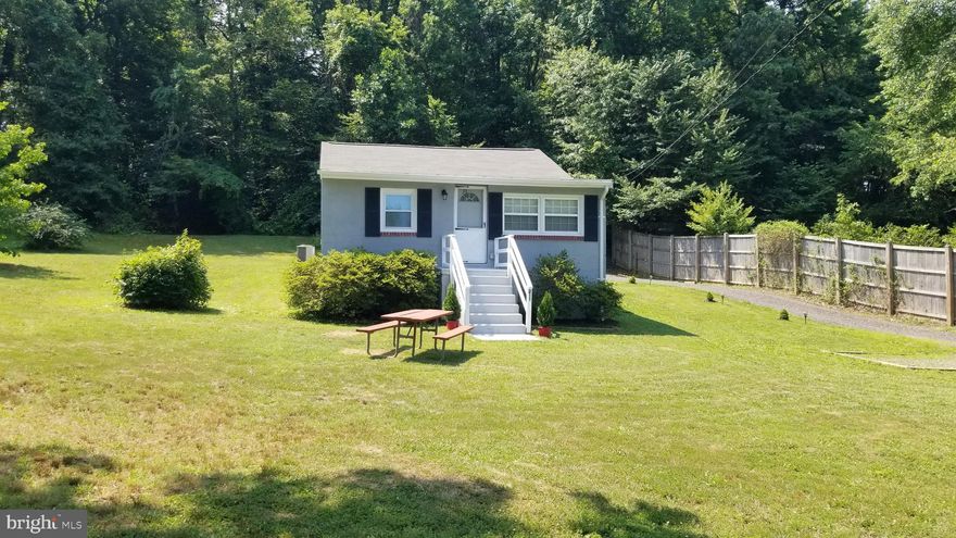 Welcome Home to this Perfect 2 bedroom, 1 Bathroom Cottage.  Newly Renovated top to bottom.  Peaceful and Tranquil Yard and Patio to unwind and entertain.  A nature lover's paradise.  You won't find a home with this setting in the area.  Large Laundry/Storage room, with full size NEW stacking Washer/Dryer.  Bluetooth speaker in Ceiling. New water conditioner. All NEW Stainless appliances.  Sitting room off of Bedroom.  Nice sized bathroom with a full bathtub. Shed for extra storage.  Call today, this won't last long!