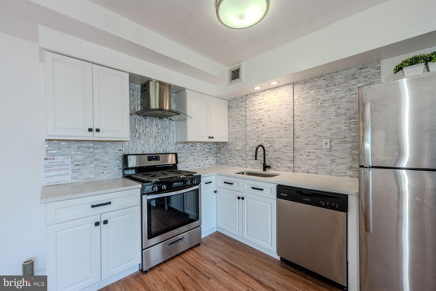 ✨ NEW PRICE! ✨ Welcome to Condo 713 at The Oglethorpe Condominiums—a beautifully renovated 1-bedroom + den, 1-bath home in the heart of the vibrant Hyattsville Arts District! With ALL utilities included and just minutes to Metro, shopping, dining, and entertainment, this condo blends modern upgrades with unbeatable convenience.****Step inside to an open floor plan filled with natural light from a wall of windows and sliding glass doors leading to your private 7th-floor balcony—perfect for skygazing or enjoying panoramic views of the treetops and skyline.****The gourmet kitchen shines with new quartz countertops, dazzling white cabinetry, designer backsplash, and brand-new stainless steel appliances, including a gas range with a sleek glass-and-steel hood. The adjoining dining area, accented with a crystal chandelier, is ideal for both everyday meals and entertaining.****The versatile den offers a stylish home office or flex space, complete with built-ins. The renovated bathroom features a modern vanity with granite counters, updated lighting, matte fixtures, and a refinished cast-iron soaking tub surrounded by stone tile.****Wide-plank flooring continues into the spacious primary bedroom, where you’ll find another stunning panoramic window and a walk-in closet that’s sure to impress.****Convenience continues with a laundry room just steps from your door, extra storage on the lower level, and a secure, well-lit private parking lot. The community itself offers a luxury lobby, two elevators, a picnic and BBQ area, and an on-site property manager, creating both comfort and peace of mind.****Commuters will love the easy access to Metro, bus stops, MARC, and major routes. Nearby attractions include The Westfield Prince George’s Plaza Mall, local parks, and the lively Hyattsville Arts District.****If you’re looking for contemporary style, everyday convenience, and a prime location, Condo 713 is the perfect choice! Some photos virtually staged.