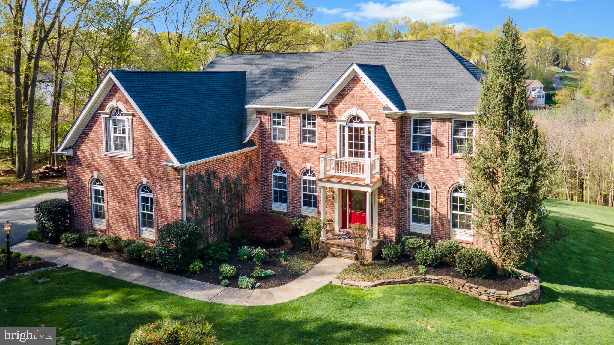This elegant, custom-built home offers an exquisite living experience! It is located in the coveted community of Cameron Mill, in the Hereford Zone. It is sited on 1.33 peaceful acres overlooking an expanse of wooded land that provides easy walking access to the NCR Trail. The main floor offers a smooth layout, with a spacious cook’s kitchen, a large eating area, a sunroom that is flooded with natural light provided by lots of windows, and an amazing million-dollar view. Flow into a great room with a two-story, soaring cathedral ceiling and a two-story brick fireplace; great for family gatherings, parties, and holidays. Step through French doors onto a maintenance-free deck. The formal dining room, living room, library, half-bath, and laundry area off the kitchen, all with 9’ ceilings, complete this main level. The upper level features 4 bedrooms and two bathrooms. The main hall offers an overlook to the great room. The primary suite is 28’ x 32’ with three walk-in closets, a private sitting room with French doors from the main bedroom, and a spa bathroom; a corner soaking tub, walk-in shower with custom tilework, double sink with granite counters and a flat-screen TV complete your spa experience. The fully finished walkout basement has a gym (or has been hardwired to be a home theater) and offers two rooms perfect for your home office or as an in-law suite, a full bathroom, a kitchenette, and a large storage area with built-in shelves. Walk out from this level onto a flagstone patio that provides a stunning view and a custom-built garden shed that blends with the exterior of the home, perfect for your gardening tools and lawn equipment. Dual zone heat and central air. All rooms, including the master bathroom, have built-in Boston speakers and controls for sound. Lush, mature landscaping around the entire exterior of the home with extensive custom stacked stone makes a statement. A three-car garage for your vehicles allows you to come and go easily in any weather.