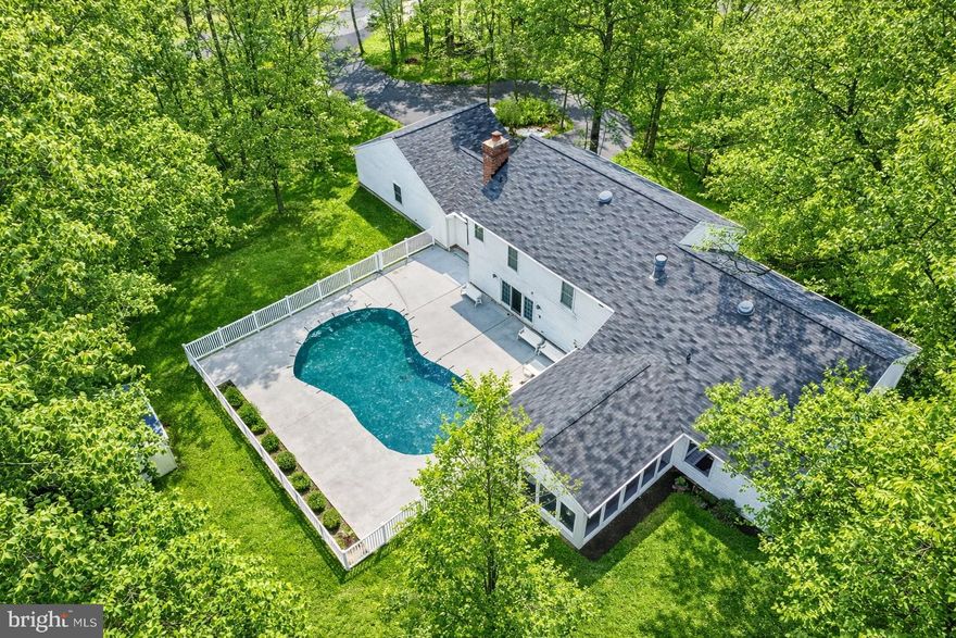 Welcome to this exceptional custom-built contemporary split-level home offering space, versatility, and resort-style outdoor living — all nestled on a very private lot in Westminster.

Designed for both everyday comfort and entertaining, this 5-bedroom, 3 full bath home features generously sized rooms and multiple living areas throughout.

The main level offers expansive formal living and dining rooms filled with natural light — ideal for gatherings and special occasions. The oversized eat-in kitchen is the true heart of the home, boasting a dramatic extended granite island, abundant cabinetry, extensive prep space, and sliders leading to a fully enclosed rear patio — perfect for enjoying the outdoors in comfort.

Step outside and experience your own private retreat. The in-ground pool is perfectly positioned for summer entertaining, weekend relaxation, or hosting unforgettable poolside gatherings — all surrounded by the privacy this lot provides.

The spacious primary suite includes a private bath, creating a peaceful escape. Just a few steps down, you’ll find two additional generously sized bedrooms and a full bath located off the large family room. Sliders from the family room provide seamless access to the pool area, enhancing the indoor-outdoor flow. This level also includes conveniently located laundry and an oversized mudroom leading directly to the garage.

The lower level offers abundant storage space and houses the utilities, providing excellent functionality without sacrificing living areas.

This thoughtfully designed custom home combines spacious interiors, flexible living areas, and exceptional outdoor privacy — a rare opportunity for those seeking room to grow and space to entertain in a private setting.

📍 Ideally located in Westminster with convenient access to shopping, dining, and commuter routes.
                                    The Forest Conservation can be released as me for the details