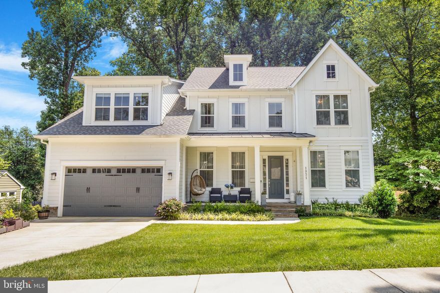 Pristine 6,500+ sq ft Stanley Martin modern farmhouse, custom designed blending upscale and natural materials. The durable Hardie Plank Board & Batten exterior adds rustic charm, while the inviting front porch evokes a classic neighborhood feel. Inside, soaring 10 ft ceilings and oversized windows (up to 7 ft tall) create bright, cheerful interiors. Specialty window treatments—including sheer horizontal shades, 2” faux wood blinds, and double-layer curtains—offer privacy and move-in-ready comfort. Wide-plank 5” engineered hardwoods run through the first and second floors.

Designer lighting and accessories elevate the home throughout. The chef’s kitchen features a large quartz island, marble tile backsplash with quartz counters, and cabinetry that extends into the eat-in space—perfect for entertaining. Full-height upper cabinets and a walk-in pantry with a window provide ample storage. High-end appliances include a GE Monogram gas stove, Samsung Bespoke fridge, Sharp drawer microwave, LG dishwasher, and GE double oven. A custom exhaust hood vents outside.

A rear deck and stone patio offer ambient lighting, and solar lights highlight the landscaped backyard, filled with fruit trees and flowering shrubs (see list). A butler’s pantry with wine fridge connects the kitchen and formal dining room. A main-level bedroom and full bath accommodate guests or a home office.

Upstairs, a loft living room provides a cozy retreat. The expansive owner’s suite includes a sitting room, dual walk-in closets, and a spa-like bath with a deep freestanding tub, oversized shower with Calacatta Bianco marble tile, and an 11 ft vanity with makeup desk. Three additional bedrooms and two baths—one ensuite, one with shared access—complete the level, all with Venetian marble vanities and tiled floors.

The walk-out lower level feels above ground with abundant windows. Ideal for an in-law or au pair suite, it features a massive rec room, game room, 6th bedroom or office, 5th full bath, and a mini kitchen with wet bar—perfect for entertaining.

The spacious two-car garage includes room for tools and toys. Landscaping features flowering and fruit trees, plus a “Green Giant Arborvitae” hedge that will mature into a 30’ privacy screen. The home is HERS-rated with a Smart Trane HVAC system. A 2-10 Home Warranty covers systems and appliances through 8/26/2027, and structural components through 9/12/2032.

Prime location near Silver Line McLean and Orange Line West Falls Church Metro stations, with easy access to I-66, I-495, and the Dulles Toll Road. Enjoy performances at Capital One Hall, shop at Tysons Galleria, and pick up groceries at Trader Joe’s, Wegmans, and Safeway. Idylwood Plaza offers Starbucks and more. Located in the sought-after Marshall School Pyramid.

Come see it today!