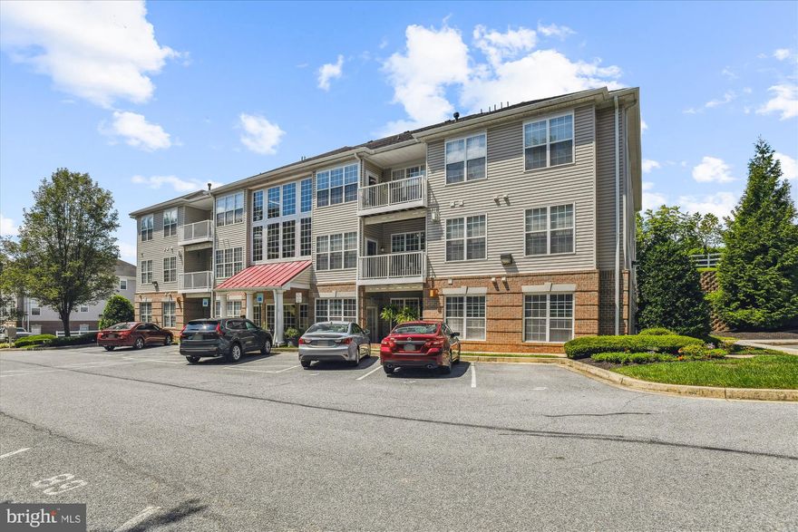 Welcome to Homeland Condominium in Eldersburg, a delightful 55+ community! This lovely penthouse level condo is ready for you to move right in. Featuring 1 bedroom and 1 bathroom it has a spacious layout, soaring ceilings, and a fantastic view from your private rear balcony. Just bring your furniture and settle in.
You can step out onto the balcony from either the living room or the primary bedroom. The generous living room includes a remote-controlled gas corner fireplace, perfect for relaxing. The eat-in kitchen is a chef’s dream with its beautiful stainless steel appliances, ample oak cabinetry, and a convenient pass-through window to the living area.
A separate utility room off the kitchen includes a stackable washer/dryer and provides easy access to the HVAC system and water heater. The bright primary bedroom features a walk-in closet and direct access to the bathroom.
You’ll have one assigned parking spot and plenty of visitor parking. The condo offers level access from the parking area to the lobby with an elevator—no steps to navigate! There’s even a separate storage unit if you need extra space.  Boasting a LOW condo fee and no HOA fee this home is a smart purchase for the savvy home buyer.
Located on a quiet cul-de-sac with minimal traffic, this home is conveniently situated just a mile from various restaurants and shops, including Walmart, Kohl’s, Home Depot, Safeway, and Martins. It truly shines with pride of ownership! Come see it today!
