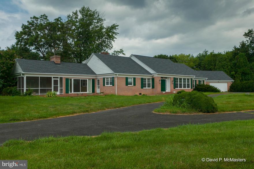 Back on Market. Estate sale: Big, gracious, great looking all brick Cape Cod  +  Guest/caretaker/In-Law brick house on hilltop just outside Charles Town. Big rooms, high ceilings, wide halls. NEW ROOF. Nice views, great privacy! 1st floor Master Suite, big comfy LR, library, parquet FR w/FP. Big lawn, great trees. 2c gar. Big screened porch. 3 min to casino, 15 to MARC train. Classic custom home.