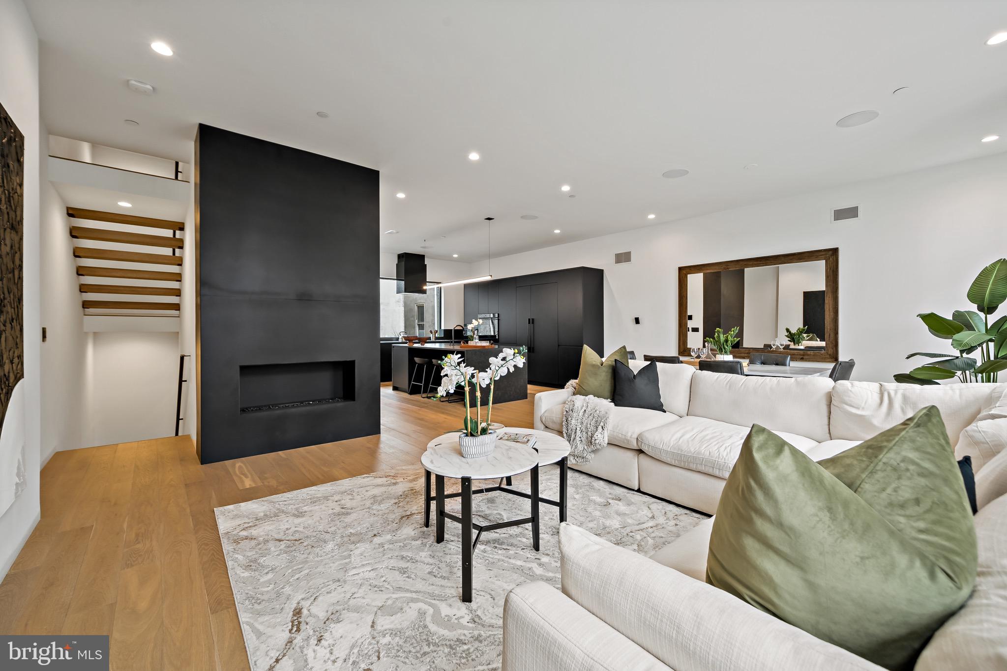 1355 Kater Street is a modern 26 feet wide new construction townhome located in the highly sought-after Bella Vista neighborhood. This home takes luxury city living to the next level with custom finishes and stunning architectural details on every floor. Fully equipped with 4 bedrooms, 4.5 bathrooms, Savant Smart Home System, 2 car garage with electric car charging, and a 6-stop elevator. This home features a distinctive brick screen facade, a sleek kitchen with Fisher Paykel appliances and European Cabinetry, 10’ ceilings, recessed trim work, a fully finished basement, custom built-in closets, multiple wet bars & outdoor spaces, a fireplace with custom blackened steel surround, custom designed metal work throughout, and so much more. All bedrooms have in-suite bathrooms. The primary bathroom is exquisitely curated with Porcelanosa tiles, a heated bathroom floor, and a steam shower system. The spacious primary bedroom leads to a private courtyard. There is also a private rooftop deck, and wired for outdoor entertainment. In a prime location, this home is nestled in the heart of Center City Philadelphia. In walking distance to Broad Street, public transportation, and some of the most popular restaurants in Philadelphia. There is a full 10 Year Tax Abatement for the property as well!