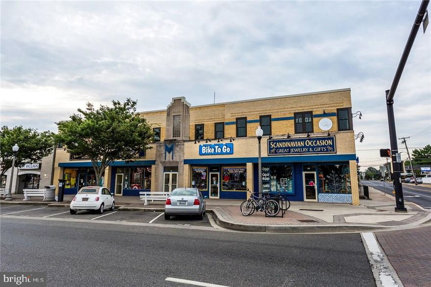 Income producing property two blocks from the Oceanfront & Boardwalk in Rehoboth Beach, centrally located on the corner of Rehoboth Avenue and Second Street, the heart of the commercial corridor. Visibility and Accessibility.  7 retail spaces all tenant occupied. 6 Residential apartments. Rental income! 15,540 SF two story block building built 1949. Permitted uses include, but not limited to hotel, restaurants, retail, apartments, professional offices, etc.