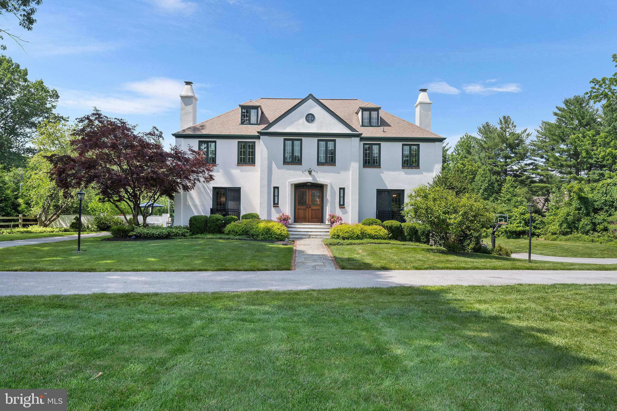 Welcome to 1263 Argyle Road, Berwyn, PA - A property like this is rarely offered!
Set at the end of a no through street in one of Berwyn’s most desirable neighborhoods, this gorgeous French Colonial is a rare find. With incredible curb appeal, an oversized driveway, and 2 pristine, manicured acres bordered by woods, this home offers privacy, beauty, and space to enjoy both inside and out. The neighborhood is perfect for walking, bike riding, and enjoying the peaceful surroundings—all within the award-winning Tredyffrin-Easttown School District.
The outdoor living space is an entertainer’s dream, featuring an in-ground pool, putting green, extensive hardscaping with multiple patios, a built-in fire pit, and plenty of yard left to relax, garden, or play.
Inside, the home boasts a bright, open floor plan with two large gathering rooms, a renovated chef’s kitchen outfitted with Viking and Sub-Zero appliances, a formal dining room, and a versatile first-floor office or in-law/au pair suite with full bath. Upstairs you'll find four bedrooms, three full baths and a laundry room equipped with cabinets for additional storage. The spacious primary suite is adjoined by a large, light filled bathroom and custom oversized walk-in closet.
A staircase leads from the second level to the unfinished third level offers over 500 sq ft of flexible potential—ideal for an additional bedroom, playroom, or home office. The walk-out lower level is designed for fun and function, with a sitting area and bar that open to a new flagstone patio with steps leading to the pool. Two more large rooms on this level provide additional space for recreation or relaxation.
Upgraded and meticulously maintained, this home has undergone many improvements throughout the current ownership. Enjoy a beautifully renovated kitchen featuring modern finishes, as well as significant hardscape additions that elevate the outdoor living space. Updates also include new electrical and lighting systems, upgraded HVAC, fresh interior paint, a new pool filter and heating system as well enhanced landscaping for added privacy and curb appeal. Additionally, the home also features a whole-house generator for uninterrupted power and peace of mind.
This is a rare opportunity to own a move-in-ready home that combines luxury, function, and lifestyle—all in one of the Main Line’s most sought-after locations!