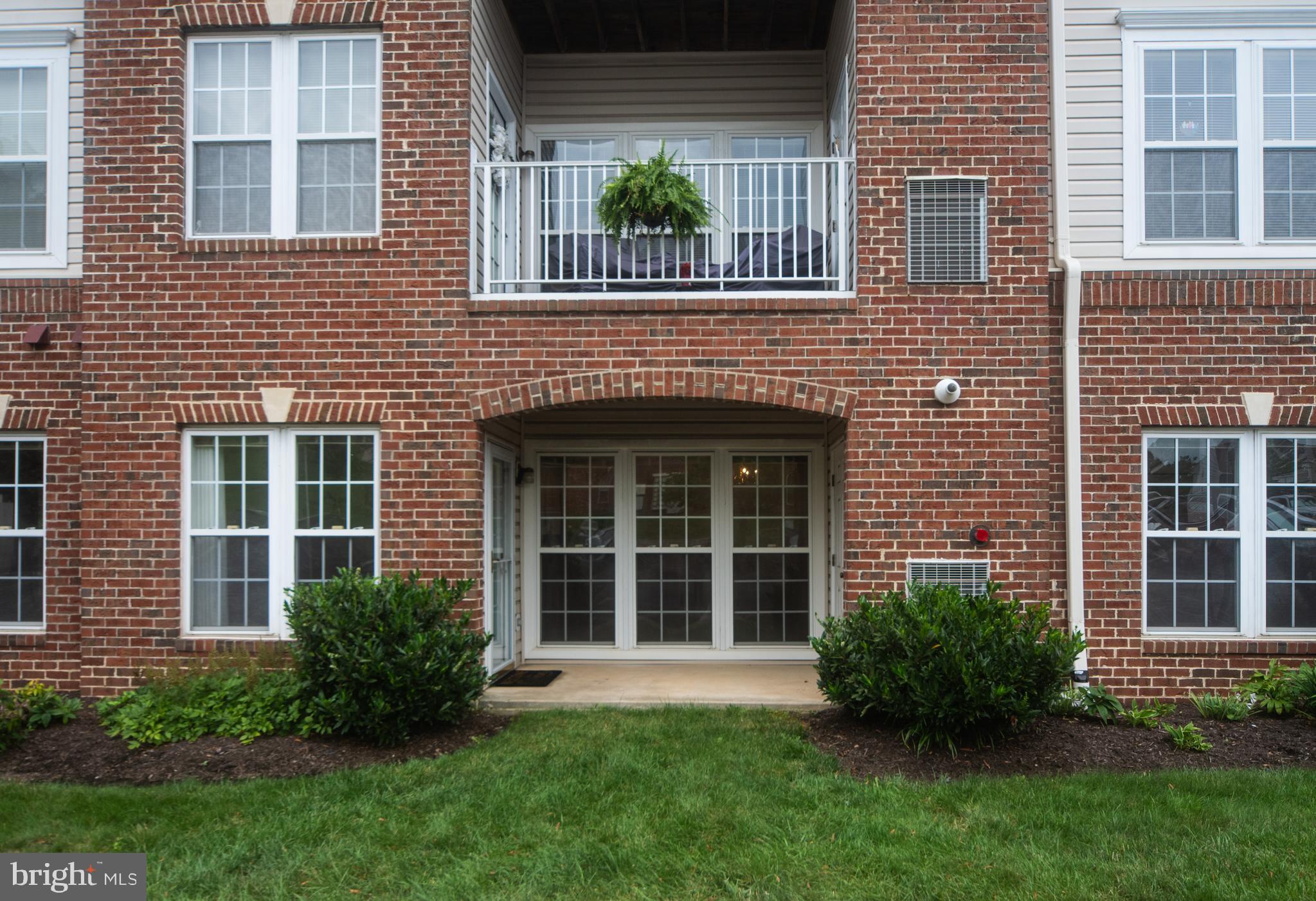 This end-unit, ground-level condo in Piney Orchard is light-filled and well-maintained.
Step inside to a welcoming foyer featuring both a coat closet and a generous storage closet. The open-concept living and dining area is perfect for entertaining with a convenient pass-thru to the kitchen.
French doors lead to a bright and versatile sunroom/den that opens to a covered patio. Enjoy direct access to a grassy outdoor space and the walking trail, perfect for pet owners!
The two bedrooms are located on opposite ends of the condo. The spacious primary suite boasts two closets (including a walk-in) and an en-suite bath with dual vanities, a linen closet, and a walk-in shower with bench. The second bedroom has an en-suite full bath that is also accessible from the living area.
Additional features include gated community, secure building with intercom access, option to enter your condo from the building or directly through your patio, HVAC (2019), Refrigerator (2018), freshly painted living room and sunroom/den and new carpet throughout.
This property offers the perfect balance of convenience and tranquility. Take advantage of the many walking/biking trails in the community and nearby parks. There are 3 outdoor pools, indoor pool, and fitness center as well as the Piney Orchard marketplace featuring a grocery store, coffee shop, Italian and Asian cuisine options & more. This home is just minutes from Fort Meade as well as an abundance of local shopping and dining. Location allows easy access to major commuter routes including 100, 32, 95 and is convenient to BWI, Baltimore/Annapolis/DC and the MARC train station. Schedule a showing today and experience living in this premier neighborhood! This home is move-in ready and is one you don't want to miss!