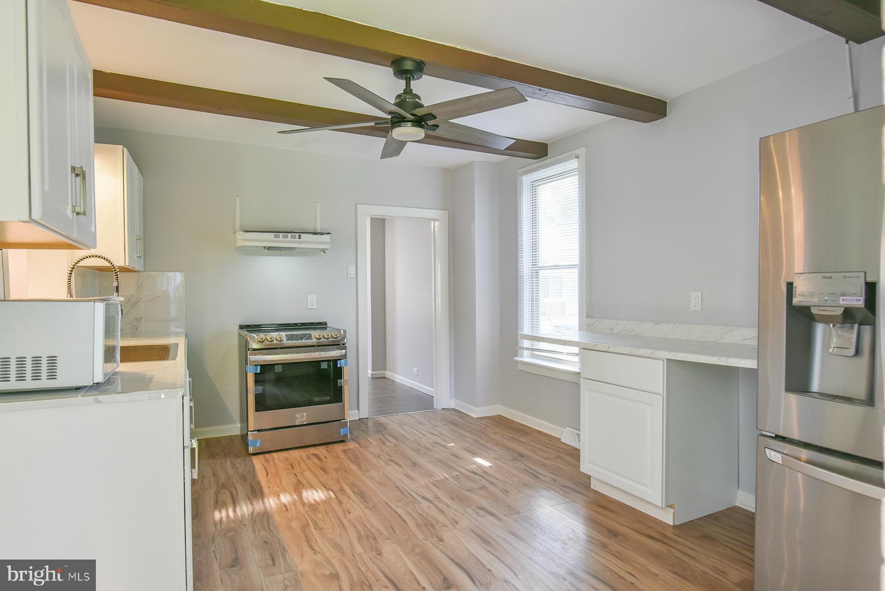 ** The City of Hagerstown is offering $7,500 to qualified buyers towards closing costs, via the Homeownership Program** Don't miss this beautifully renovated home offering comfort, style, and space! A brand new central air conditioning and heating system has just been installed, providing year-round energy-efficient comfort. This spacious home features three finished levels, including a fully finished attic! Step inside to find all-new flooring, fresh interior paint, updated fixtures, and a renovated full bathroom with modern finishes. The home is filled with natural light thanks to replacement windows throughout. Enjoy multiple living areas, including a welcoming family room, a formal living room, and a separate dining room ideal for entertaining. The completely updated kitchen features stylish stainless steel deep sink, stove, range hood, refrigerator. The unfinished cellar style basement makes for good additional storage. Outside, you'll find a massive backyard, offering endless possibilities for gardening, outdoor entertaining, or future expansion. Conveniently located near shopping, schools, and commuter routes. Don't miss your chance to own this move-in ready home with major updates already done—schedule your tour today!