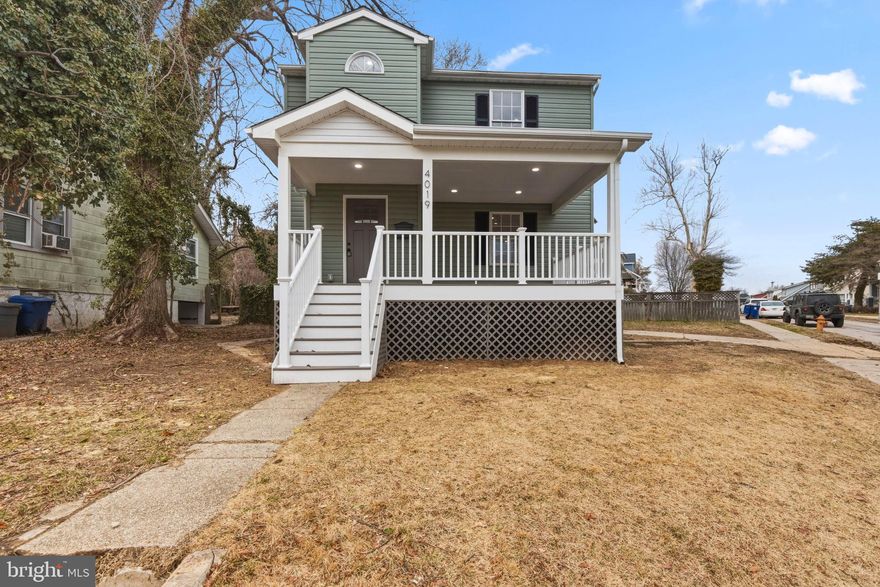Welcome to 4019 Ridgecroft Road in Baltimore — a beautifully renovated Colonial offering space, warmth, and versatility designed for comfortable living. A large covered front porch with exterior lighting creates a welcoming first impression and provides the perfect setting for morning sunrise or evening relaxation. Beneath the porch, convenient under-porch storage adds practical functionality without sacrificing curb appeal.  Inside, the home features 3 bedrooms and 2.5 baths above grade, complemented by recessed lighting, abundant natural light, and a thoughtful flow between living and dining spaces. The kitchen offers clean sightlines and efficient workspace, connecting seamlessly to the heart of the home.  Upstairs, the primary suite includes its own private bath, while additional bedrooms feature sliding closet doors and comfortable proportions. Bathrooms feature smart mirrors and luxury tiling. The layout balances openness with defined spaces, ideal for both daily living and hosting.  The lower level expands the footprint significantly, offering a private 4th bedroom and full bath, and laundry area, creating excellent flexibility for guests, multi-generational living, or a dedicated office or recreation area.  Outdoor living continues in the rear with a patio area perfect for entertaining, a privacy fence for added seclusion, a storage shed, and a private driveway providing off-street parking. The yard offers room to garden, play, or simply enjoy additional outdoor space rarely found at this price point.  This is a well-appointed, move-in-ready home that combines classic architecture with modern livability in a convenient location.