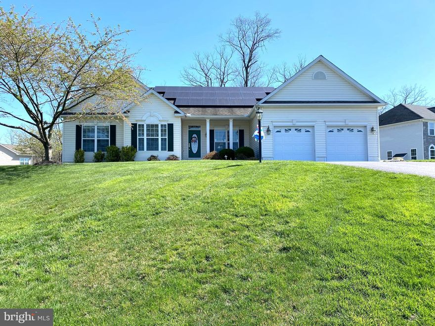 Welcome Home!!  This Immaculate rancher home in Brookfield on the Potomac offers scenic view on a beautiful corner lot backed to a wooded area.   Walk into  this  beautiful open floor plan  with hardwood throughout the main level cathedral and 9 foot ceilings .  This home features formal living and dining area and a beautiful cathedral ceiling  sun room with plenty of window views to sit and relax .  Your home office or possibly a 4th bedroom awaits just inside the front entry.   Master Bedroom with added space to have a sitting area  this suite has walk-in closet and master bath   , with two additional large bedrooms and full bath located on opposite side of house.  Laundry is located on the main level. There is a half bath for guests. Kitchen is nice open area with a breakfast bar.  In the sunroom you will find doors to the concrete patio to enjoy those nice summer days. The lower level basement has 9 foot ceilings and access to backyard.  Walk down  lower level steps to a nice  about 500 sq foot finished space with carpet and a half bath,  open a door to rest of basement and find plenty of storage area that could be finished in the future .  This home has a solar system that comes with home and has been paid for so no lease for equipment . This offers great savings on electric bills.  The air system has a built in humidifier and filter system .  The owners had home built and never had animals it's also been a non smoking residence.  The community offers  deeded river access with a boat ramp .  Home is convenient to commuter routes, shopping and  restaurants. This home won't last long so schedule your showing today!!!