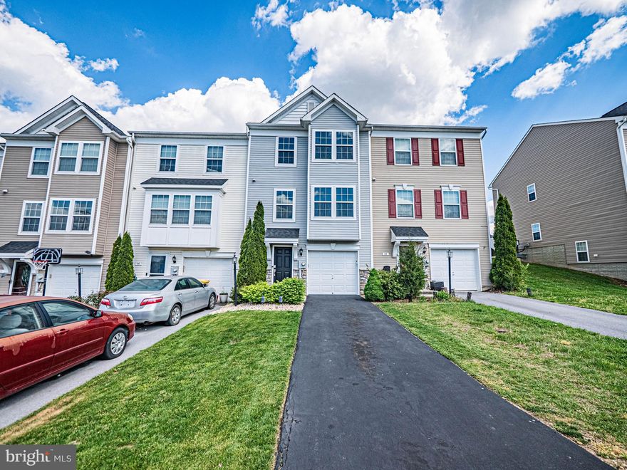Gorgeous, sun-filled, and fully updated townhome offering 3 bedrooms, 2.5 baths, and breathtaking, unobstructed views of North Mountain—protected to ensure your scenery remains untouched for years to come. Step inside to a welcoming foyer featuring Pargo engineered hardwood floors and convenient access to the one-car garage. The entry level also includes a versatile home office (or potential 4th bedroom) with plush carpeting, bathroom rough-in, and a dedicated laundry area.The main level is designed for both everyday living and entertaining, showcasing engineered hardwood flooring, recessed lighting, and an open-concept kitchen and dining area. The kitchen features granite countertops, stainless steel appliances, a center island, pantry, and a bright morning room that walks out to a private deck overlooking lush green space, mature trees, and perennial landscaping.The kitchen seamlessly flows into the spacious family room, complete with abundant natural light and a conveniently located powder room.
Upstairs, the oversized primary suite impresses with a walk-in closet, three-level bump-out, and a spa-inspired ensuite bath featuring dual vanities, granite countertops, tiled flooring, a soaking tub, and a separate shower.Two additional generously sized bedrooms share a beautifully updated full hallway bath with granite counters and modern finishes. MAJOR UPDATES WITHIN THE LAST FOUR YEARS: Engineered hardwood floors installed in the foyer, kitchen,and family room. New light fixtures installed throughout!! Granite countertops installed in the kitchen and bathrooms.