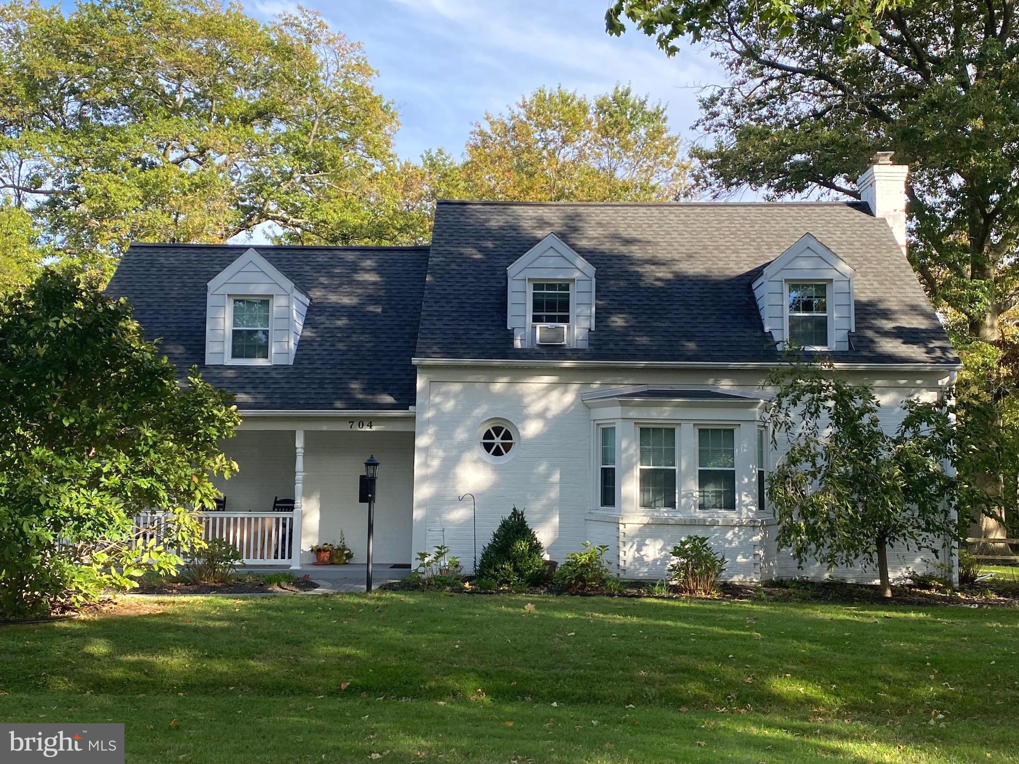 This Charming 4 bed Cape Cod combines original historic details with modern updates just steps from downtown West Chester. Expansive fenced-in double lot with mature trees, large matched shed and EP Henry walkways and patio. Large renovated eat -in kitchen with additional seating at the counter for three. Spacious living room brightened by bay window showcasing massive mantle atop wood-burning fireplace, built-in cabinetry and 5 in-wall speakers for surround sound. A newly renovated powder room with barn door  and high ceiling bonus room complete the first floor. Second floor features large main bedroom with dual closets, 3 additional bedrooms  and a renovated full bath with lighted, fog-less mirror. Both floors feature refinished hardwoods, crown moulding, and recessed lighting. The 728 sq ft basement is partially finished(545 sq ft)with additional storage space, French drain water remediation system, and walk-out access to back yard. Other mentionables; Temperature controlled by 2 Nest Smart thermostats, LG smart air conditioner unit, Kevo automatic smart front door lock you can open with your phone. The included whole house generator with transfer switch make this home the perfect place to ride out a storm. Close to Marshall Square Park!