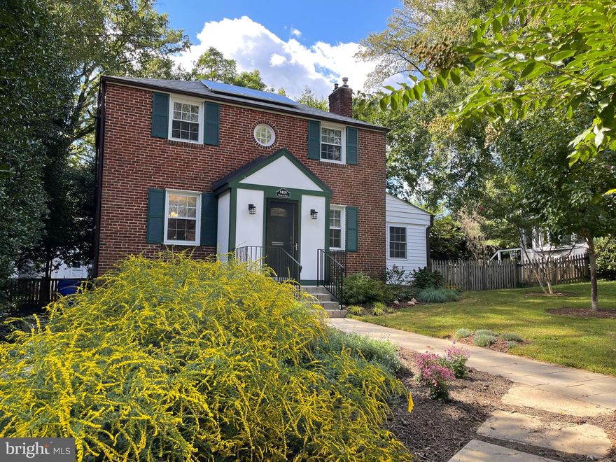 Beautiful Colonial with an amazing screened porch and mature, easy to maintain garden in the wonderful Woodside Forest neighborhood of Silver Spring! As you approach the home note the stunning professionally planted perennial garden in front of the house. The native plants are easy to maintain and offer a variety of color throughout the growing season. Off street parking makes life easy. As you enter the home you will find a spacious foyer with lots of storage. The main level of the home features hardwood floors, an open kitchen with breakfast bar, large living room with wood burning fireplace that was converted to gas with an insert and built-ins, an elegant dining room, and a separate office/sunroom with tons of natural light. The house is great for both family life and entertaining. The recently added screened porch which is accessed from the kitchen is a perfect spot for everything from family meals and social gatherings to quiet reflection with a book or watching birds. The hardwood floors continue throughout the upstairs where you will find three sunny bedrooms. The primary bedroom includes an en suite bathroom with a surprising amount of storage. Two additional bedrooms and another full bathroom in the hallway complete the second level. The fully finished basement features an open rec room/play area, bathroom, an exercise and laundry area and an oversized storage room along with walkout stairs to the rear yard. Roof solar installation provides significant energy cost savings, in fact the electric bills over the last year averaged less than $29/month - WOW! The partially fenced-in backyard is perfect for both entertaining and relaxing with its deck for grilling, screened porch for outdoor dining, garden for planting, and open flat green space for playing, all surrounded by mature trees, making it a private and natural oasis! This freshly painted, move-in ready home provides an idyllic, peaceful sanctuary perched on a picturesque block in Woodside Forest, while still offering an uber-convenient location with quick access to downtown Silver Spring (1 mile south), Washington, D.C., the Metro (Forest Glen or Downtown Silver Spring), major commuter routes (495), as well as being steps away from Sligo Creek Park and nature trails, the new and popular restaurant Zinnia, and Snider's grocery store. Recent system upgrades include New Lighting (2022), Full interior paint (2022), New Roof (2019), New Water Heater (2019), New A/C (2016), New furnace (2014). There's nothing to do but move in. Welcome home!
