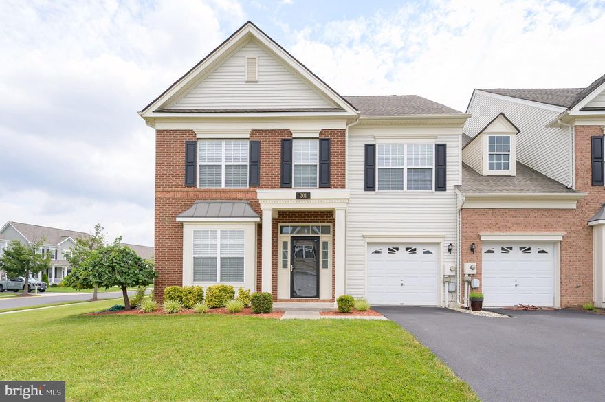 Welcome Home to 201 Strathmore Way East! This luxurious brick front, 2-level twin semi-detached home in the highly sought-after community of Martinsburg Station has it ALL: beautiful hardwood and ceramic tile flooring throughout the main level with newer carpet throughout the upper level; gorgeous granite countertops and stainless-steel appliances in the kitchen, and crown molding throughout the main level.  The main floor also features not one but two bump outs – one in the dining room and one in the kitchen. Upstairs, you’ll find 3 bedrooms, including a HUGE primary bedroom with a tray ceiling and spa-like en-suite bathroom that boasts an elegant fully glass-enclosed walk-in shower, a double vanity, and a large corner soaking tub.  But wait - there’s more!  The home’s HVAC system was replaced in February of this year, Sellers recently installed new windows where they were needed, the water softener and appliances were all replaced in 2021 and the home was recently freshly painted! Step out front and you’ll find beautiful landscaping, a manicured lawn, and gorgeous mountain views surrounding the community! Around back, you’ll find a trex deck and large paver-style patio giving you the abundant outdoor space to relax or entertain. Pair all of the above with the myriad amenities that Martinsburg Station has to offer (including a clubhouse, a large inground pool, tennis courts, playgrounds, walking trails and more) and you’ll surely conclude this home AND this community have it all!  Don’t miss out – schedule your showing today!