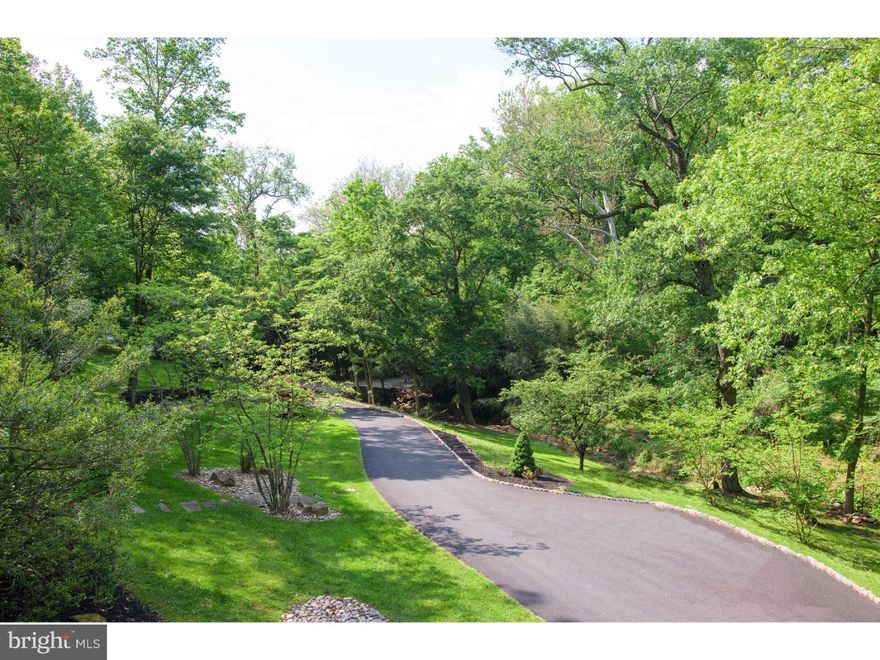 Distinguished by clean lines and an engaging open floor plan this 5+ bedroom 5 2 1/2 bath contemporary stunner is thoughtfully positioned on a verdant 3 acre parcel ringed by centennial trees for privacy & highlighted by multi-level patios, walled terraces, secluded decks and a tiered recirculating koi pond, positioned by the double front entry doors. Dramatic 2 story Foyer with honed travertine stone flrs offers a vibrant, sophisticated entrance that connects all 1st level spaces & bathes the home in natural light. Centrally located Kitchen is detailed w/richly stained cabinets, honey toned granite counters & high level appliances including six burner plus 24 inch griddle Viking stove, 2 full sized ovens, wine chiller, sub-zero freezer/refrigeration & 2 brushed stainless sinks for the ultimate pairing of design & superior function. Steps away are a spacious dining area opening to a wide, eastern facing deck offering options for both indoor & al fresco entertaining as well as an adjacent intimate reading or TV space. Designed as a 5th Bedroom with updated full bath,now currently purposed as the primary home office, this room enjoys unparalleled views of the home's managed  ponds & water gardens.  Completing this level is a step down Great Rm w/soaring ceilings & wood burning f/p. Find dramatic contrast from the dark wood flrs, light walls & two walls of windows with sliding doors that invite you to the wrap around deck with custom seating & inset planters for seasonal color. Ascend the turned stair to a catwalk which traverses the two story foyer. Grand Master Ste w/volume ceiling & treetop views connects to a covered terrace, ideal for an end of day retreat while a spiral stair leads to the terraces & gardens below. A spa-like neutral honed marble Master bath with deep "bubble tub" also offers two large walk-in closets, spacious cove shower. Two additional bedrooms & updated bath are also found on this level. Fabulous LL exits to the front of the home at grade level & offers a full in law suite with large Bedrm, full bath, kitchenette and separate entrance.Gym with half bath & laundry/storage connect to  a vestibule, 2nd home office. Pulled from a scene of a James Bond movie is a fantastic indoor pool which exits to the rear terrace and grounds. Constructed of plank cedar, natural stone and honed black slate flooring the space is enhanced by a tiled wall mural, bath, sauna, hot tub, floor to ceiling glass on 2 exposures & skylights overhead.