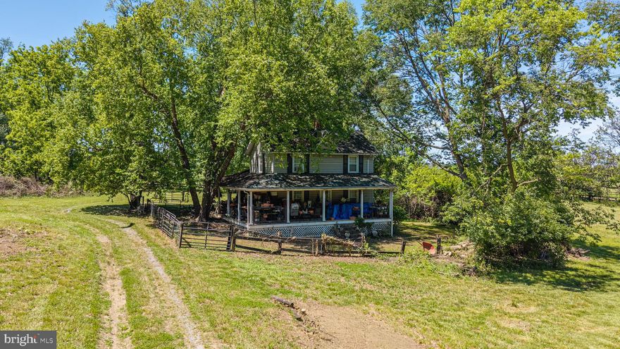 This charming farmhouse-style residence offers a unique opportunity to own a small farm in Loudoun Co, perfect for those seeking a tranquil retreat or private farm.  With its picturesque setting, the property boasts panoramic views of lush pastures and scenic vistas, inviting you to unwind and embrace the beauty of nature.  The farmland behind is in conservation easement, which gives you more privacy and uninterrupted views. The exterior of the home features a delightful combination of stucco and vinyl siding, exuding a timeless appeal. A wrap-around porch beckons you to enjoy morning coffee or evening sunsets while surrounded by the serene countryside and your horses. The property is thoughtfully designed for equestrian enthusiasts, complete with horse amenities that include a 6 stall stable, paddocks, and a run-in shed.  A prime location, smack dab in the middle of horse country, and an easy drive to 3 different foxhunts. Inside, the home offers 1,396 square feet of cozy living space, featuring three inviting bedrooms and one and a half bathrooms. The layout is perfect for both relaxation and entertaining, with ample natural light flooding through the windows, creating a warm and inviting atmosphere. This idyllic setting provides the perfect backdrop for outdoor activities, whether it's riding horses, gardening, or simply enjoying the tranquility of rural living. The property is a true paradise with endless possibilities, from creating your own hunt box to establishing a serene garden oasis. With no association fees or restrictions, you have the freedom to personalize your lifestyle in this exclusive haven and the opportunity to embrace a luxurious yet grounded lifestyle.  This property is not just a home; it's a lifestyle choice that invites you to experience the joys of country living.   This home is sold AS-IS and by appointment only. The owner will need a post-occupancy agreement.