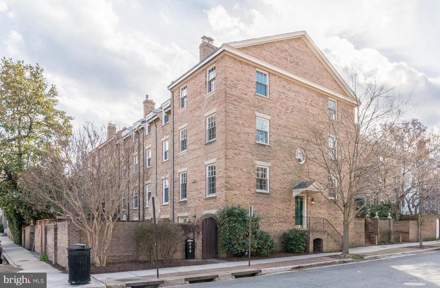 . Sparkling end townhouse w/ 3000 sqft of light filled living space. 2 wood burning fireplaces, hdwd fls throughout, and newly updated kitchen.. The owners suite features an extra lg windowed walk-in closet. The large dining room opens to a beautifully landscaped walled patio.  Walk Score 95!