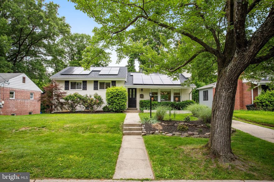 Welcome home to 9309 E Parkhill Drive, a beautifully updated five-bedroom, three-bathroom home located in the highly sought-after Parkview neighborhood of Bethesda. Offering over 2,500 square feet of thoughtfully designed living space on a large lot, this home perfectly blends modern comfort with eco-conscious upgrades—all within the convenience of the Beltway.

Step inside to an open-concept main level featuring gleaming hardwood floors, abundant natural light, and a seamless flow ideal for both everyday living and entertaining. The gourmet kitchen is a standout, complete with quartz countertops, smart Samsung appliances, and easy access to a spacious deck and newly paved patio—perfect for hosting gatherings or enjoying an evening outdoors.

Downstairs, the fully finished walkout lower level provides incredible flexibility with two additional bedrooms, dual living areas, a full bathroom, and a private kitchenette. Whether you're accommodating guests, extended family, or looking for rental income potential, this level offers both comfort and privacy.

This home also boasts a host of modern upgrades including energy-saving solar panels, an updated electric panel, dual laundry areas, and spa-inspired bathrooms. Modern windows throughout add a sense of tranquility, while off-street parking and ample storage provide convenience. The lush, flat backyard, framed by vibrant foliage, offers a private oasis just minutes from local parks, scenic trails, and major commuting routes.