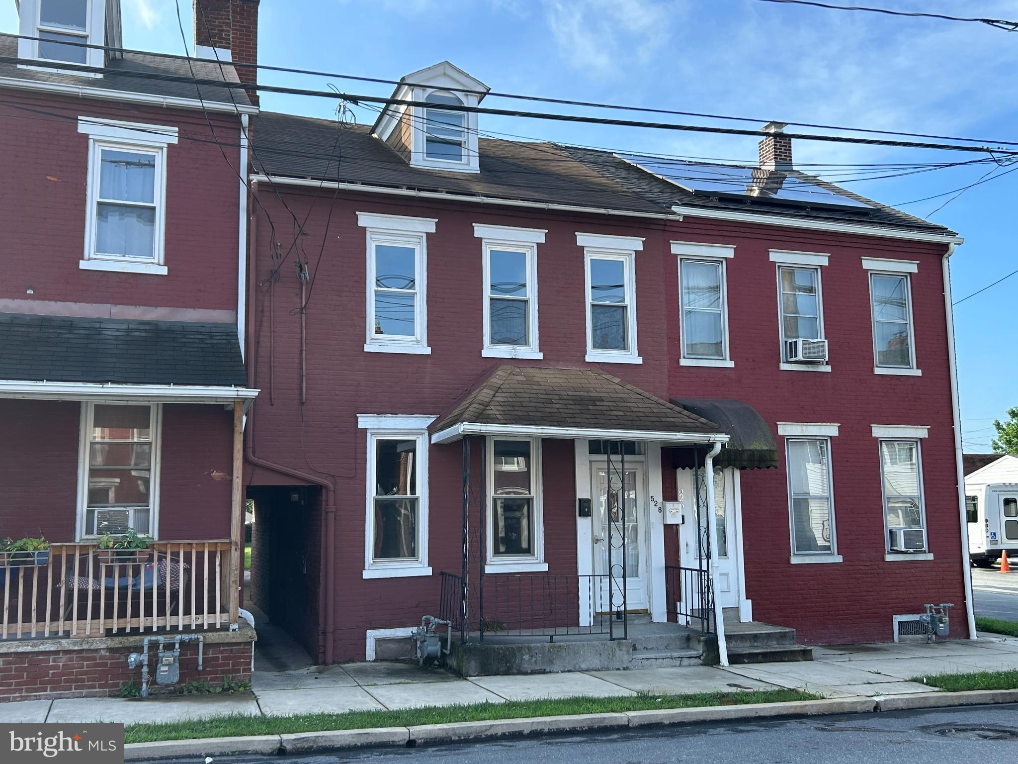 Discover a prime investment opportunity with this charming 6-bedroom, 2-(full) bathroom house. This interior row home features a classic design and solid brick construction, ensuring durability and low maintenance. This property offers off-street parking, 1st floor bathroom with walk-in shower and a total of 6 private bedrooms (yes, one is pretty small - but no privacy violations). The demand for rental properties in this area remains strong and this one is already licensed as a rental - get it while you can. Also, makes a great starter home.
