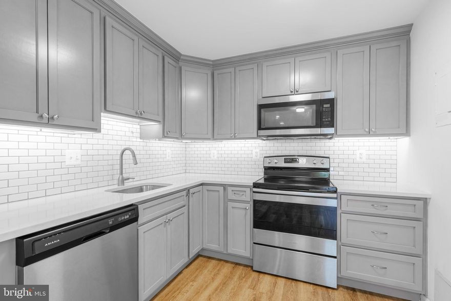 OFFER DEADLINE OF THURSDAY, AUGUST 15 AT 5PM. Welcome to The Chateaux! This move in ready one-bedroom, one-bathroom corner unit condo offers a perfect blend of comfort and convenience in a serene garden-style building. Step inside your private entrance to discover a welcoming foyer with a coat closet and oversized windows that flood the space with natural light. The open layout features new luxury vinyl plank flooring throughout. The modern kitchen boasts new cabinets and appliances replaced in June 2021. The remodeled bathroom boasts contemporary fixtures and finishes that were replaced in 2021. The spacious primary bedroom includes three generous closets, offering ample storage for all your belongings. Enjoy the outdoors from your covered patio, perfect for relaxing or entertaining guests. This unit includes one assigned parking directly in front of the condo for your convenience as well additional hang tags for visitors. The HVAC system was replaced in September 2018, ensuring year-round comfort. Best of all, all utilities are included in the condo fee, simplifying your living expenses. Located in Falls Church, the Chateaux offers easy access to  amenities and attractions. Enjoy the connivence of a variety of dining, shopping, and entertainment options. Nearby parks and trails provide ample opportunities for outdoor recreation. Convenient public transportation make this an ideal location for all. With close proximity to major highways and the Metro, commuting to DC and surrounding areas is a breeze. Don't miss this opportunity to own a beautiful corner unit in a prime location with all the modern amenities you desire. Welcome home to the Chateaux!