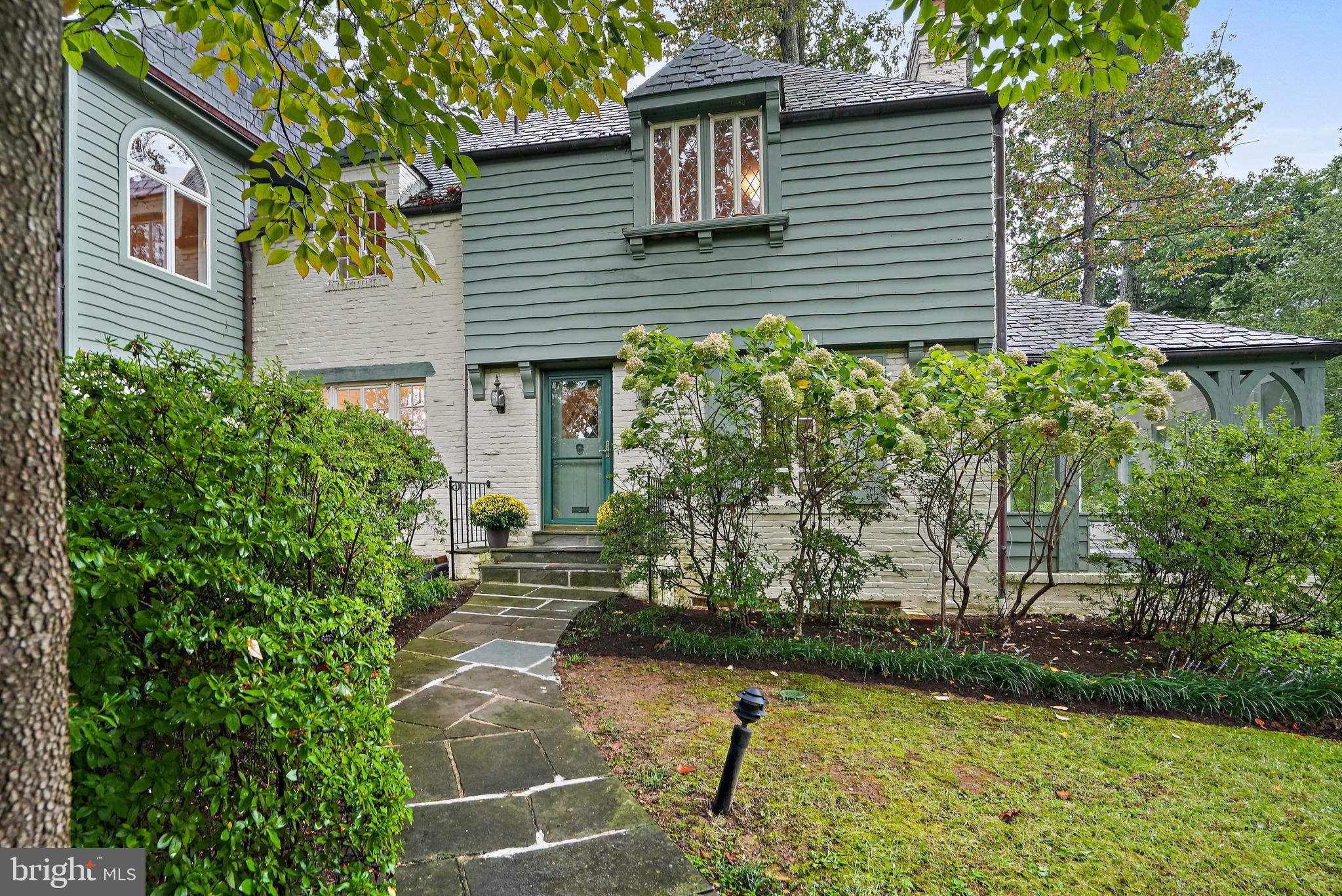 Welcome to 3112 Rolling Road, a charming Tudor-style home situated in the desirable Rollingwood community. This spacious residence offers approximately 4,000 square feet of versatile living space on a generous 8,700 square foot lot. With a seamless blend of classic elegance and casual comfort, this home presents an opportunity to explore its unique potential.
Built in 1936, this property blends charm with possibilities for modern enhancements. Step into the inviting foyer, leading down to a formal living room where a wood-burning fireplace serves as a cozy focal point. The main level also features a formal dining room, office space, sunporch, and a full bath. The expanded kitchen and living areas on the main floor provide ample space for everyday living and entertaining.
The well-designed second floor layout includes four bedrooms and three bathrooms. The spacious primary suite is a peaceful retreat, offering privacy and serenity. The basement includes a bonus rec room as well as a bedroom and bath, perfect for accommodating guests.
This home is located just blocks away from the Brookville Market shops, the renowned La Ferme restaurant, a vibrant weekend farmers market, and the scenic trails of Rock Creek Park. It is also just minutes from downtown Bethesda and Washington, DC. Embrace the exceptional opportunity to craft your dream home in this serene and desirable community of Chevy Chase.
Square footage approximate and based on third party.