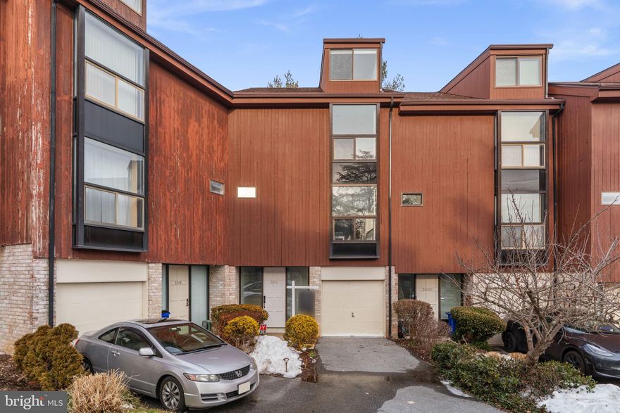 Come see this amazing garage townhome in the heart of Columbia. This home boasts tons of natural lights through its large windows and sky lights. Brand new paint and carpets throughout the house means you can move right in! As you step through the front door you will head down the hall past garage access, a half bath and enter a large den with wood burning fireplace and access to your massive private deck. As you head upstairs, you will be welcomed by a large living room, another half bath, and eat-in kitchen. The 3rd floor has a massive primary suite with vaulted ceilings, lots of closet space and a grand en-suite bathroom.  Down the hall is another large bedroom and full bathroom. There is a fourth floor with another expansive room with ample closets that could be another bedroom, office, or den.  The entire house has been freshly painted and new carpets throughout.  The location of this well appointed home doesn't get much better. It is next to a neighborhood playground and walking distance to the Columbia Mall, wholefoods, and Merriweather district. Close to commuter routes off 29 and 175. Condo association covers exterior maintenance such as roof and siding. Also covers water bill. The Columbia Association covers parks and walking paths as well as discounts to gyms and pools. Priced to sell quickly come see it today before its gone.