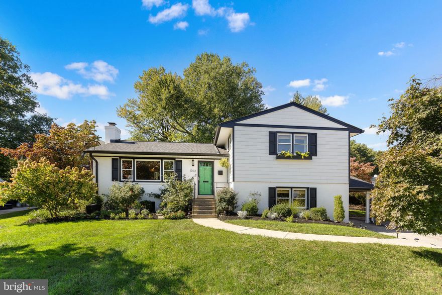 W-O-W! Must See in West Lewisville Heights/McLean! Beautifully Renovated & Expanded with Contemporary Flair! This captivating 4BR/4BA split-level in the sought-after McLean High School pyramid showcases wide plank flooring, high-end show-stopping light fixtures, fully remodeled baths, and a private landscaped backyard. The main level boasts an open, sunlit living and dining area centered around a wood-burning fireplace with a striking designer tile surround. The renovated open kitchen impresses with sleek stainless-steel appliances, a showpiece tile backsplash, quartz countertops with a waterfall edge, and a door to the large deck (built-in 2020). The main-level addition offers a sunroom with a vaulted ceiling and door to the deck and fenced backyard, a large laundry room, and a gorgeous full bath featuring a walk-in shower and stunning contemporary finishes. Upstairs, you'll find three bedrooms, including the airy ensuite primary.  Both the primary and hall baths boast stylish, modern renovations. The lower levels feature a spacious family room with built-ins and a door to the carport, a fourth bedroom with an ensuite bath, and a huge rec room with new carpeting. The oversized utility room offers ample storage. Recent updates include a newer roof, siding, A/C (2021), and a brand-new washer and dryer.  Easy access to commuter routes (495/66), the McLean Metro (Silver line), and a Metro bus stop, and just minutes to everything Tysons Corner and Northern Virginia have to offer. Move right in to start enjoying your own piece of McLean paradise today!