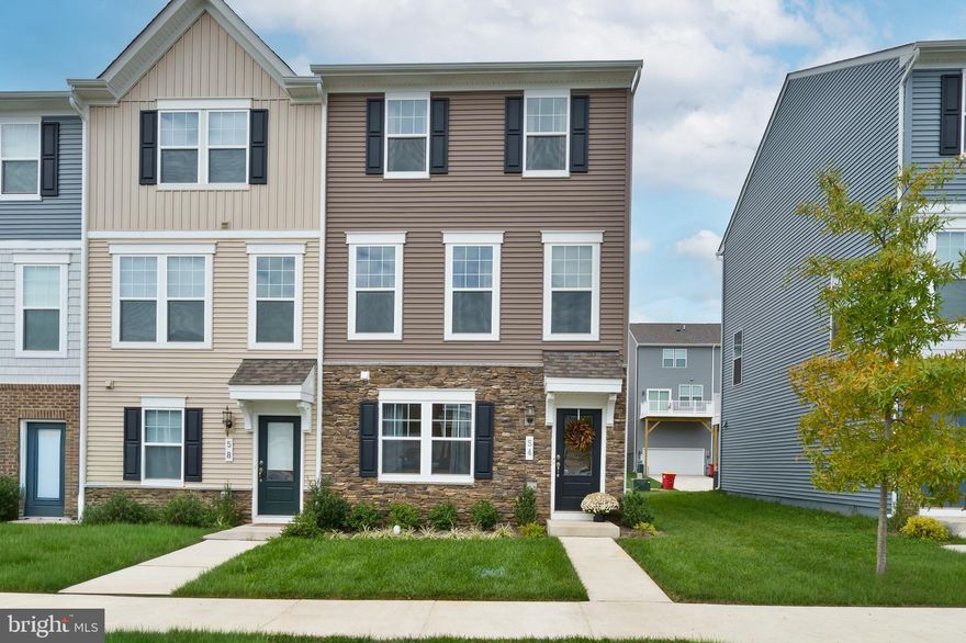 This almost new 2024 END-UNIT townhome is pristine, move-in ready, and waiting for you. Skip the construction delays and months of uncertainty; this one is complete, clean, and checks every box.  It's clean and bright and well-taken care of and ready for you!

With 3 bedrooms, 2.5 baths, and approximately 1,760 sq. ft. across three finished levels, this Hastings townhome blends modern style, space, and function. The exterior features striking Pennsylvania ledgestone detailing for standout curb appeal. Inside, the main level is filled with natural light and features luxury vinyl plank flooring throughout. The modern kitchen showcases quartz countertops, a large island, and stainless steel appliances. The open-concept living and dining areas flow beautifully to the deck, perfect for relaxing or entertaining. Upstairs, you’ll find a bright primary suite with two walk-in closets and a private en-suite bath featuring a walk-in shower with glass sliding doors, along with two additional bedrooms and another full bathroom. The lower level offers a versatile flex space, ideal for a home gym, office, or hobby area, with direct access to the rear-facing 2-car garage.

The sellers have added thoughtful upgrades you won’t find in new construction:
Culligan whole-home water treatment system
Attractive window hardware and premium roller shades
Washer & Dryer convey as well

Lifestyle perks abound. Walk to Potomac Marketplace, enjoy Blue Ridge Mountain views, and commute easily via Rt. 9 and Rt. 340 into Virginia or Maryland. Sidewalks and low-maintenance living make this community a favorite.

Square footage and dimensions are estimates; buyer to perform due diligence. Sellers will be using Cardinal Title for closing.