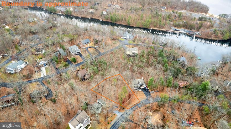 NEW PRICE - GREAT VALUE!!!  Sellers have outgrown the need for this lot they used as a membership lot.  Time for new owner(s) to benefit from this buildable lot in the gated community of Lake Holiday. It is priced  below the new tax assessed value! The wooded land slopes down to a walkable area, perfect for a walk-out basement home.
Located a short drive from Winchester VA  and 1.5 hours from NoVa, Lake Holiday Country Club boasts a 240-acre man-made lake suitable for most water activities. Enjoy two sandy beach areas, a boat marina with kayak and canoe storage, beach volleyball/tennis court/basketball court located at the clubhouse,  18 hole disc golf,  fenced dog park, food trucks on summer weekends, and year-round community events for all ages. 

Additional amenities include a fenced garden area with reservable plots, convenient mailbox locations, a trash dumpster, and a boat storage lot. The updated clubhouse features a large great room with a commercial kitchen, a gym, a lending library, and a summer convenience store.

Lake Holiday offers the best of country living with lots of trees, paved roads, and minimal noise and light pollution.  Almost guaranteed to spot deer as you drive the neighborhood roads.

Community water and sewer are serviced by Aqua (hookup fee: $5,000). HOA fees are $139/month for undeveloped lot, with a one-time $2,000 capitalization fee due at closing.

Don't miss out on this fantastic opportunity to enjoy the vibrant Lake Holiday community.    Contact me today to learn more!