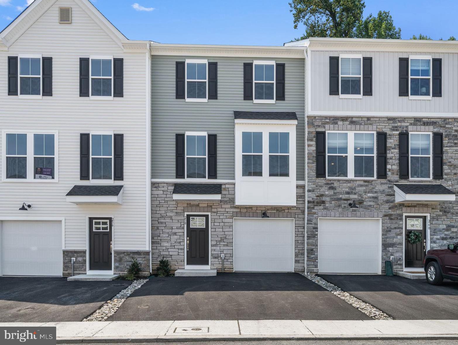 Now available for immediate occupancy! This beautiful, never-lived-in townhome in Downingtown Ridge offers a perfect blend of style, comfort, and convenience — all located in the highly rated Downingtown Area School District with Downingtown STEM Academy and Downingtown West High School.
The open-concept first floor is anchored by a bright white kitchen with quartz countertops, subway tile backsplash, stainless steel appliances including a gas range, and a spacious center island. From the kitchen, step out onto the rear deck with private views of the woods. Wide-plank flooring flows throughout the main level, adding warmth and a touch of elegance. A dining area, great room and a convenient powder room is also located on this level.
Upstairs, you’ll find three comfortable bedrooms, including a primary suite with a walk-in closet and a sleek en-suite bath with dual sink quartz vanity and a walk-in tile shower. A full hall bath and laundry area complete the second floor. Washer and dryer included.
The finished lower level adds valuable flexible living space — perfect for a home office, gym, or media room — and includes an additional powder room and access to the 1-car garage.
Close to Routes 30, 202 and the Downingtown Train Station. Close proximity to local parks, shopping and dining in Downingtown, Exton, and West Chester.
If you’re looking for a low-maintenance, move-in ready rental in a prime location — this one checks all the boxes. Schedule your tour today!