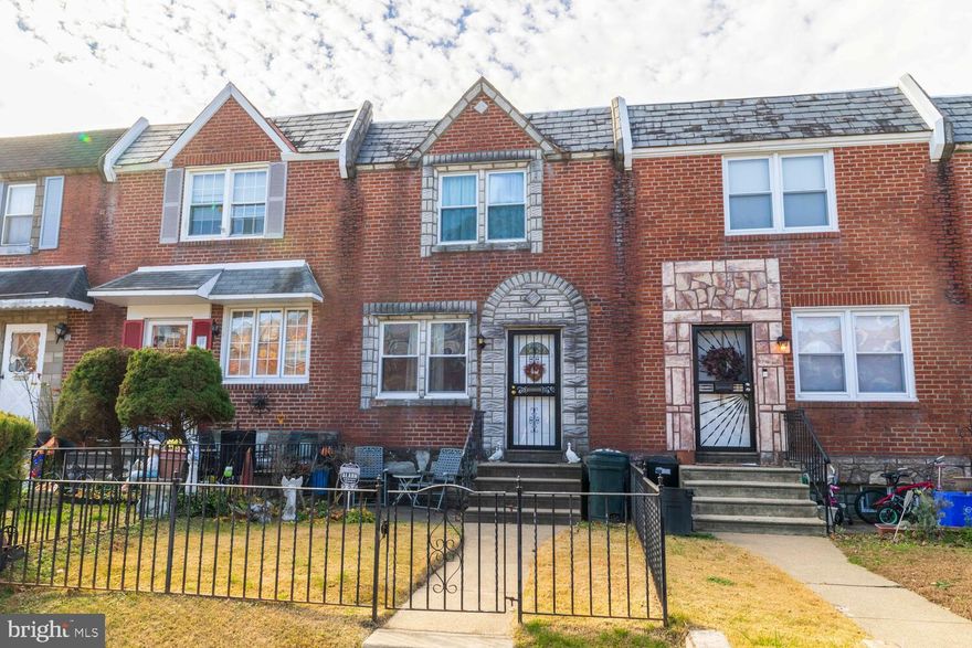 Welcome to your quintessential Northeast Philly townhome! This well-maintained, brick-front residence is the perfect blend of classic charm and everyday convenience.

Step inside to discover gleaming hardwood floors and a spacious floor plan that feels like a true retreat. The home features a beautiful archway leading into a formal dining room, complete with a nostalgic pass-through to the eat-in kitchen—an ideal setup for both quiet nights in and lively entertaining.

Key Features:

Comfort & Accessibility: Generous bedrooms with ample closet space on the second floor, plus a convenient chair lift.

Flexible Living: A finished basement family room perfect for hobbies, movie nights, or a play area, plus extensive built-in storage.

Outdoor Space: Enjoy a fenced-in front yard with elegant wrought iron fencing and a private, fenced-in backyard.

Parking: Private driveway leading to an attached one-car garage.

Modern Essentials: Gas hot air heat, central A/C, and a central ceramic tile bath.