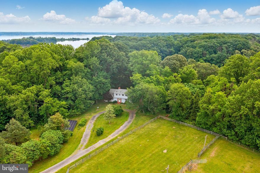 Welcome to 13931 Eagles Nest Farm Lane, a rare 60-acre waterfront retreat nestled in the heart of Kent County, Maryland. Set along the scenic banks of Lloyd Creek, this stunning and secluded property offers a one-of-a-kind opportunity for hunters, equestrians, and nature lovers alike. With a half-acre pond, approximately 1,690 feet of shoreline, and abundant wildlife, it’s a true outdoor enthusiast’s paradise. Trails meander through partially wooded areas, while expansive open fields provide both recreational space and agricultural potential.

At the center of the property is a charming 1,845 sq ft home featuring four bedrooms, two full bathrooms, solid wood floors, and cathedral ceilings in the living and dining areas. Skylights and a wood-burning fireplace enhance the warmth and character of the space. The screened-in porch and spacious 300 sq ft back deck offer peaceful spots to relax and enjoy the surrounding landscape. A 1,232 sq ft walk-out basement includes a workbench and an unfinished bathroom, ready for your personal touch.

Equestrian amenities are already in place, including a 1,968 sq ft four-stall livestock barn with tack room, a three-bay equipment shed, approximately 9.5 acres of fenced pasture with automatic waterers, four run-in sheds, and a 90’ x 150’ lighted grass riding arena bordered by classic three-rail wood fencing. An additional 15 acres of open pasture—once used for crops—adds to the property’s versatility. A 20-panel solar array supports sustainable living, and multiple sheds provide ample storage.

The property is served by well and septic, and offers the perfect blend of privacy, functionality, and natural beauty. Whether you're dreaming of a private hunting lodge, a fully equipped horse farm, or a peaceful waterfront homestead, Eagles Nest Farm is ready to welcome you home. SHOWN BY APPOINTMENT ONLY.  Please do not drive on the property without an appointment.