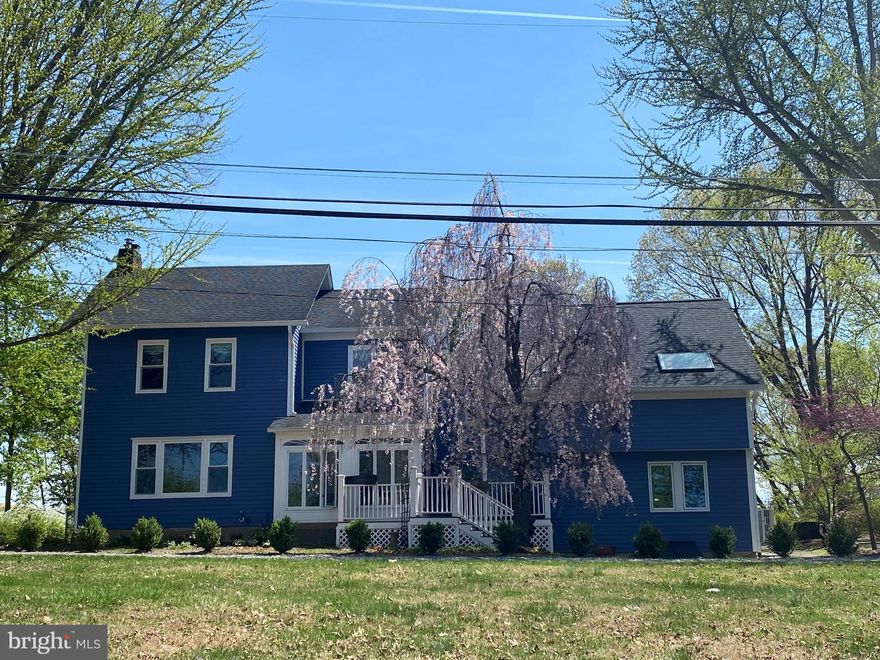 Welcome to this warm and inviting home, designed for both entertaining and relaxation. Dive into the expansive 20x40 concrete swimming pool, conveniently heated by your own solar panels. Nestled on nearly 2 acres of stunning perennial gardens, this residence boasts over 300 plant species, offering a serene and beautiful outdoor escape.

Perched high on College Hill, this exceptional property features breathtaking sunset views and seamlessly integrates classic colonial design with a contemporary addition, providing versatile living and entertaining spaces. The impressive great room features vaulted ceilings, skylights, and a spiral staircase, creating a bright, airy atmosphere. A wet bar and formal dining area enhance the setting, perfect for memorable gatherings.

The updated kitchen is a chef's dream, featuring quartz countertops, stainless steel appliances, new wall ovens, a cooktop, and a cozy breakfast nook. The finished lower level offers a flexible recreation room equipped with a pool table and a full bath, ensuring plenty of space for relaxation and fun. Elegant hardwood floors and intricate moldings throughout the home add to its timeless charm.

The inviting living room, centered around a wood-burning fireplace, serves as a warm focal point. Upstairs, the primary suite includes a spacious walk-in closet, a bonus room, and a private balcony overlooking the solar-heated pool.

Additional highlights include a gardener’s workshop with a deck, a two-car garage, ample parking, owned solar panels, and a brand-new roof. Mini-splits provide efficient heating with an oil-fired hot-water backup.

Conveniently located just minutes from Lafayette College, Starbucks, Giant Food, award-winning restaurants, The State Theater, and a bus station to NYC, this home offers an easy commute to New York City, making it an ideal weekend getaway or full-time residence.