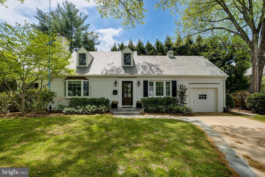 Tucked away on a quiet cul-de-sac in coveted Westmoreland Hills, 5206 Falmouth Court is a gorgeously remodeled Cape Cod offering five bedrooms, 2.5 baths, and over 2,400 square feet of finished living space. With a beautiful slate roof, this thoughtfully expanded and renovated home offers a blend of timeless charm with modern functionality.

The main level features a sun-filled living room with a fireplace, an informal dining room, a private office, and a stunning fully renovated kitchen outfitted with GE Monogram stainless steel appliances, a 6-burner cooktop, quartzite counters and backsplash, custom pantry storage, and a wet bar area. Designer lighting and stylish finishes elevate the space, while motorized window treatments in the kitchen and living room add a sleek, modern touch. Just off the kitchen, a beautifully landscaped backyard with a gorgeous stone patio, new Trex decking, and a new front walkway and driveway—an ideal setting for indoor-outdoor living.

The main-level primary suite is a true retreat, featuring a fully renovated en-suite bath, an 8x10 walk-in closet addition, and motorized shades for comfort and privacy. A stylish powder room and added storage spaces enhance everyday functionality.

Upstairs are three bedrooms, a renovated hall bath, and a spacious finished attic playroom with paneled walls, carpet, lighting, and dedicated new mini-split system for maximum comfort.

The lower level offers a spacious recreation/family room with a fireplace, a fifth bedroom, half bath, and a finished laundry room with built-in shelving, and upgraded flooring. A new HVAC system, hot water heater, washer/dryer, and nearly all new windows ensure comfort and peace of mind. The home also includes an attached garage and ample storage throughout.

With its exceptional updates, versatile layout, and incredible location just minutes from parks, trails, Bethesda and DC, this Westmoreland Hills gem is truly move-in ready.