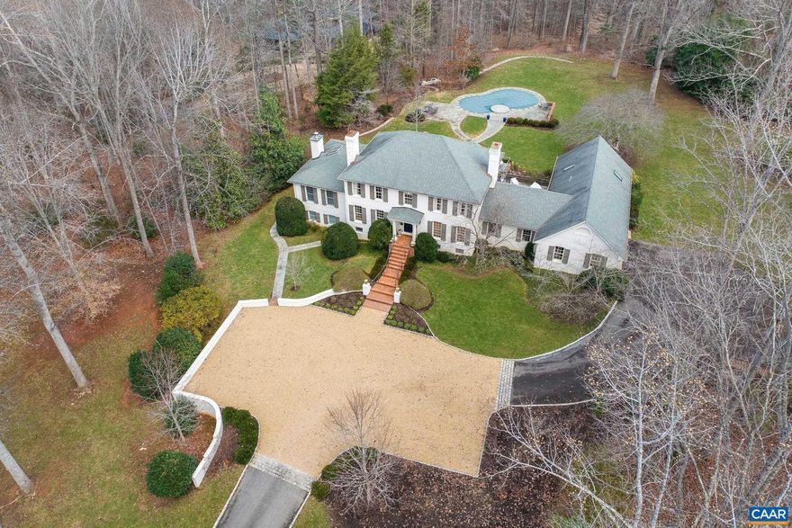 Set privately within moments of Farmington and minutes to UVA and Downtown, this classic, all brick Georgian sits on 3 lovely acres of mature landscaping complete with pool and hot tub. The floor plan provides a 1st floor primary as well as a 2nd floor primary. Recent renovations and additions provide dramatic living and entertaining spaces.  The centerpiece of the home is the recently added great room with soaring ceilings, endless windows and french door access to bluestone terraces.  On the terrace level, in addition to a family room with fireplace, there is a a bed, bath with sauna, and efficiency kitchen with its own entrance, all added in the last 10 years. The entire rear elevation of the house offers expansive bluestone terraces accessed via the great room, kitchen, and family room for wonderful flow btw interiors and the lovely outdoor living spaces.  Furnishings available. Zero road exposure.,Fireplace in Family Room,Fireplace in Great Room,Fireplace in Rec Room