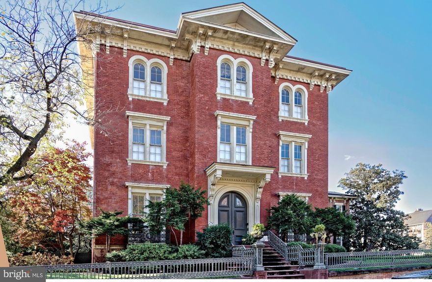 Now available for the first time in 40 years is an iconic estate property, the largest, most distinguished home in coveted Old Town, Alexandria! Spanning 14,000+ square feet and set on a generous half-acre lot, this expansive historic house presents a one-of-a-kind opportunity for the discerning buyer who appreciates incomparable elegance, prewar charm, and modern amenities in a premier location. 
Built in 1854, 510 Wolfe Street is brimming with architectural character and original details. From the stately brick façade and original ornate iron fencing to the gracious 3-story interiors, grandeur is embodied at every turn. The magnificent residence further entices offering all the comforts one could desire, with its own 4-car garage and ample driveway parking, lush private yard and sunken garden with irrigation, lovely porch with a wisteria-covered pergola, and large paver-stone patio with fans and lighting for the ultimate outdoor enjoyment. 
Adorning the spectacular main home are exquisite elements throughout, among them soaring ceilings up to 12’6”, original plaster ceiling rosettes/medallions, oversized windows inviting in beautiful natural light, 13 fireplaces (12 with original mantels), antique chandeliers, original heart pine floors, solid 6’ Virginia heart pine doors, rare 1950’s English dolphin motif stained glass accents, original crown molding/base trim, and an original circular staircase with walnut handrails ascending to upper floors. 
The stunning main level affords an ideal backdrop for entertaining. Off the gracious entry foyer sits an enormous double-parlor great room with dual fireplaces to gather around, each with marble mantles and gilded gold leaf period-matching mirrors above. Serve gourmet meals in the regal formal dining room with a butler’s pantry, connected to an original eat-in country kitchen that can be updated to suit the contemporary chef. This level also features a handsome study for lounging with coffee or cocktails; a fabulous sky-lit conservatory-sunroom with original hand-molded brick floor, original sandstone window sills, and glass doors to the rear yard; a full laundry room; and a guest powder room. Occupying the two upper floors, each marked by airy 11’6” ceilings and open landings furnished as sitting areas, are 6 bedrooms, plus a secluded in-law or guest suite with a living room, 7th bedroom, kitchenette and full bath. The primary suite is a tranquil retreat complete with a dressing room and en-suite bath, and access to a library with built-in bookshelves in the hall. Other highlights include a 1,732 sq ft unfinished top level walk-up attic with extensive storage space, stairs to a widow’s walk for savoring extraordinary Potomac River and city views, and a domed beehive brick ice house/ice cellar adding a unique touch. 
What’s more, there are 2 spacious 1,194 sq ft apartments privately located on the home’s ground level. Each comes with 2 bedrooms, 1.5 baths, a full kitchen, a washer & dryer, and dedicated HVAC unit – perfect for rental income, guest quarters, or conversion to exercise or office space for your personal use. 
 Own a special piece of Alexandria history and enjoy an unparalleled standard of living, at a prime address close to the waterfront, shops, restaurants and transportation.