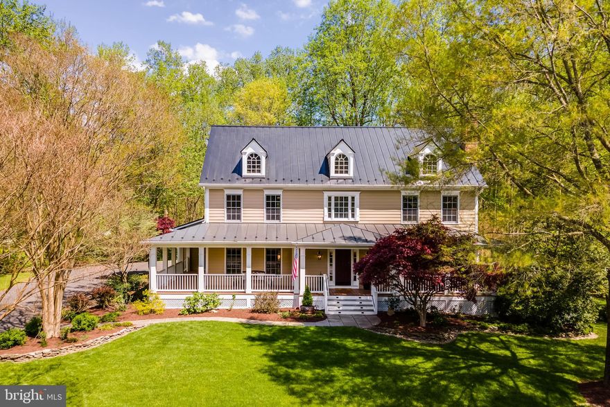 There's so much special about THIS HOUSE--where to start?!?  This Southern Living Designed home IS VERY spacious, beautifully updated, and well-appointed, has 5 large bedrooms, 4.5 baths and sits on 5 acres in a superior location YOU will love!  Significant updates inside and out have been added, including a stunning kitchen renovation with custom cabinets, backsplash, upscale stainless steel appliances, counters, lighting, and more. The main level features a large and welcoming foyer, charming living room with gas fireplace,  the lovely updated kitchen, very large dining room, expansive great room with gas fireplace, main-level office, powder room, and laundry. The primary suite features a spectacular bathroom renovation with large shower, separate soaking tub, heated floors, separate water closet, and two separate vanity areas.  There will be no fighting over bathrooms in this house as the bathroom situation upstairs is A+++.  The two front bedrooms share a delightful Jack and Jill bathroom with each bedroom having its own separate vanity area.  The fourth upper bedroom has its own private bathroom.  So nice!!!!  The lower level of this home is also just wonderfully appointed with a large family room/multipurpose area, another bedroom, an additional full bathroom, and tons of storage.  This home has fantastic outdoor areas.  There is a large Ipe deck off the kitchen and it's just beautiful.  Outside of the walkout basement doors you'll find a large stone patio,  perfect for a firepit and s'mores over the summer.  There's landscape lighting, well-groomed beds with delightful plantings, grassy play areas, woods for privacy and adventures, and an in ground sprinkler system! The roof of this house is a real boon--all metal and low maintenance!  Renovations: kitchen and appliances 2023 to include a lovely Liebherr fridge;  Miele washer and dryer, 2021; metal roof 2021; siding painted 2021; upper heat pump 2022; main furnace 2024; 75 gallon water heater 2022; primary bathroom 2023; Jack and Jill bathroom 2022; home has in-ground sprinkler system.  This home has it ALL!  And the location of this home really makes it a stand out!  Located just a short distance from Rt 123, but feeling like many miles away, you'll enjoy endless tranquility on this 5 acre lot while being just right down the road from shopping, restaurants, schools, and the VRE!