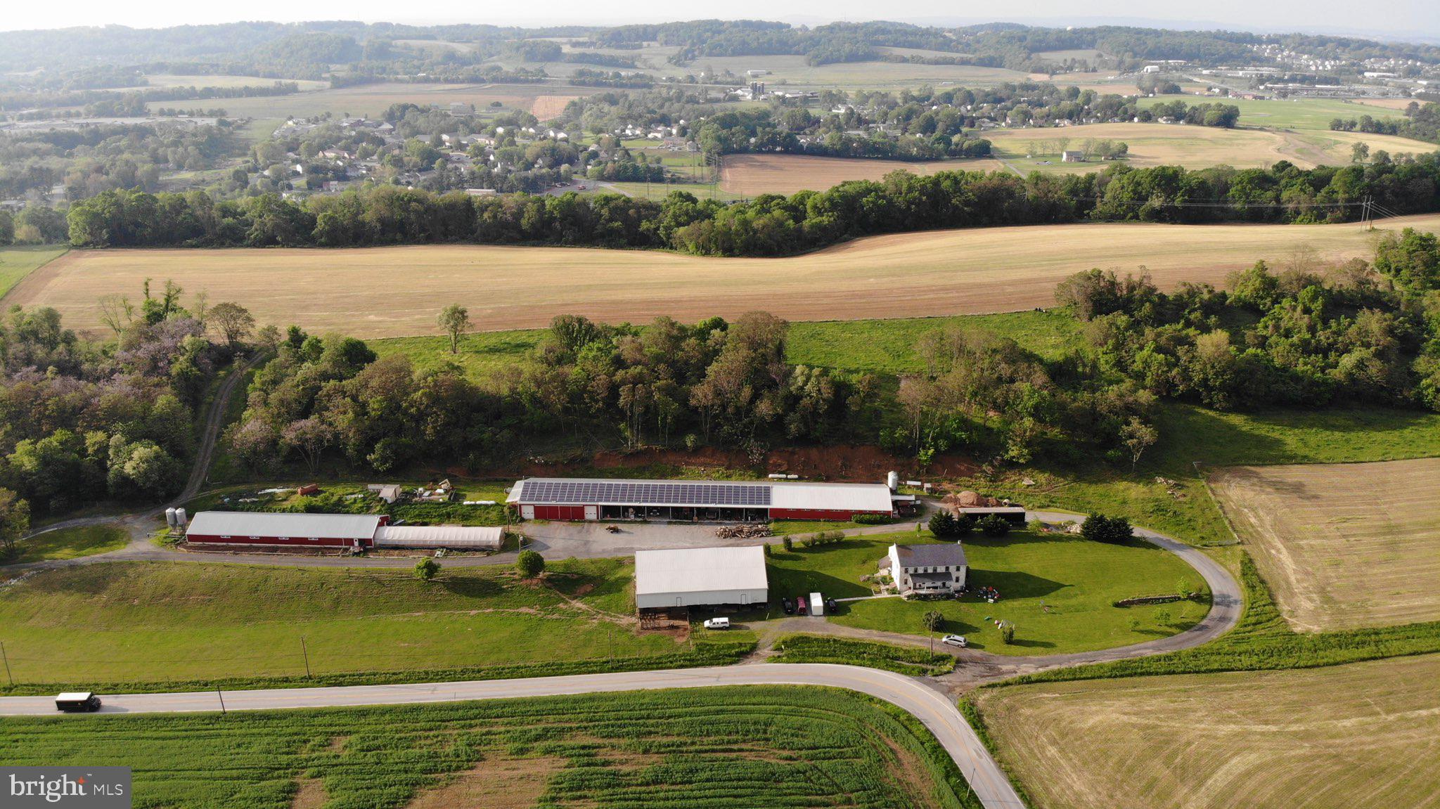 42 acres modern, income producing hog farm for sale. The 3000 sq. ft. spacious house has 5 bedrooms, 3 full bathrooms, new windows, geothermal heating, heat pump water heater. It had extensive renovations in 2015 with new wiring and plumbing throughout. The updated kitchen has granite counter-tops, a 6 burner Jenn-Air gas cook-top, large Viking refrigerator, and a dishwasher. The master suite has twin sink bureaus and large walk-in closet. The exterior of the house will get painted soon and the slate roof was serviced in April. Looking around the farm, the hog (nursery) barns (95’ X 52’ and 152’ X 41’) were completely renovated in 2013 and 2020. They have plastic slats over pits, new infrared tube heaters (2018), a recently inspected generator for backup and 4 feed bins (10 ton each). Each hog barn can house 1200-1400 pigs. Production contract potential available through Keystone Mills. Paradise Energy installed 61.6 Kw Solar System (2014) (Cost $250,000) which gives annual clean energy credits. The farm has a heated shop (52’ X 69’), an implement shed (52’ X 154’), a greenhouse (100’ X 25’), and a bank barn (53’ X 97’). The land consists of 28 acres of cropland, 8 acres of pasture and 5 acres of fenced woodland. Most of the pasture is surrounded by new woven wire fencing and an electric strand around the top. Established fruit trees and berry bushes. New variable speed, constant pressure, 22 gal/minute well pump. There is even a unique root cellar cave. Taxes are low thanks to Clean and Green. The location is close to route 30, in Penn Manor School District. Impressive income potential. Rare Lancaster County opportunity.