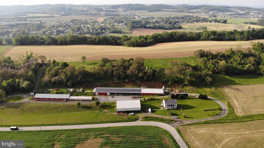 42 acres modern, income producing hog farm for sale. The 3000 sq. ft. spacious house has 5 bedrooms, 3 full bathrooms,  new windows, geothermal heating, heat pump water heater.  It had  extensive renovations in 2015 with new wiring and plumbing throughout. The updated kitchen has granite counter-tops, a 6 burner Jenn-Air gas cook-top, large Viking refrigerator, and a dishwasher. The master suite has twin sink bureaus and large walk-in closet.   The exterior of the house will get painted soon and the slate roof was serviced in April. Looking around the farm, the hog (nursery) barns (95’ X 52’ and 152’ X 41’) were completely renovated in 2013 and 2020. They have plastic slats over pits, new infrared tube heaters (2018), a recently inspected generator for backup and 4 feed bins (10 ton each). Each hog barn can house 1200-1400 pigs. Production contract potential available through Keystone Mills.  Paradise Energy installed 61.6 Kw Solar System (2014) (Cost $250,000) which gives annual clean energy credits. The farm  has a heated shop (52’ X 69’), an implement shed (52’ X 154’), a greenhouse (100’ X 25’), and a bank barn (53’ X 97’).  The land consists of 28 acres of cropland, 8 acres of pasture and 5 acres of fenced woodland.  Most of the pasture is surrounded by new woven wire fencing and an electric strand around the top. Established fruit trees and berry bushes. New variable speed, constant pressure, 22 gal/minute well pump. There is even a unique root cellar cave. Taxes are low thanks to Clean and Green. The location is close to route 30, in Penn Manor School District. Impressive income potential. Rare Lancaster County opportunity.