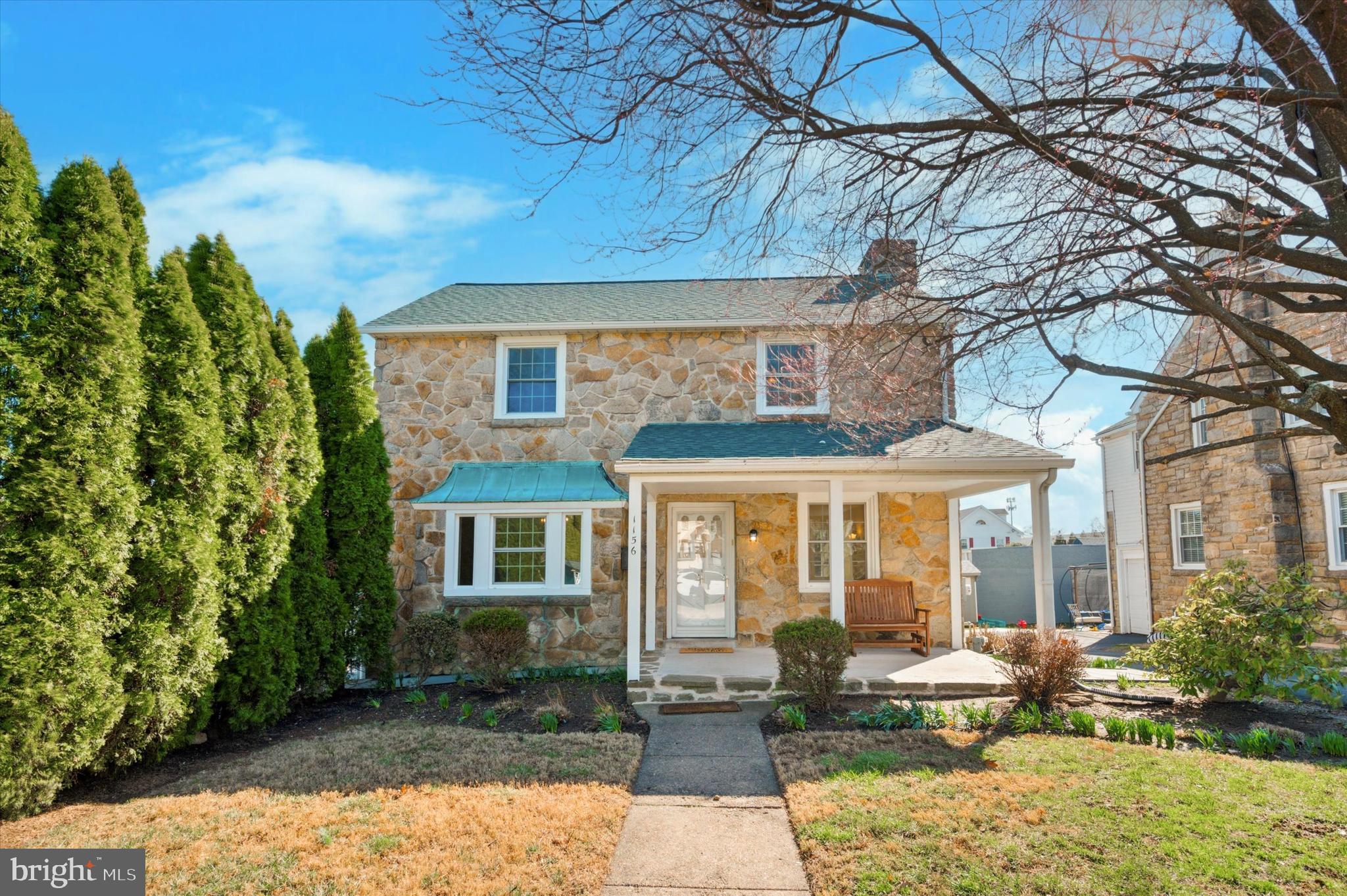 Your new rental home in Havertown just hit the market! This stone Colonial home has charming curb appeal and is equally inviting once you step inside! At just over 2200 SF of finished space, it will provide plentiful room for its next occupant, with 4 bedrooms, 3.5 bathrooms, partially finished basement, and attic space. It also includes an additional lot for an oversized yard space to enjoy - a rare find in Havertown! The home's main level includes the bright living room with wood-burning fireplace centerpiece and built-in shelving, formal dining room with bay window, and updated kitchen with ample white shaker cabinetry, granite counters, tiled backsplash, and recessed lighting. Here, you'll also find the mudroom with bench and storage, pocket door to the powder room, and door leading to the large deck with yard access. Head upstairs to the primary bedroom, including remodeled ensuite bathroom with stall shower. Another 3 bedrooms and hall bath complete this level - all bedrooms include ceiling fans with lighting. There's also the partially finished walkout basement with full bathroom, which provides versatile usable space - make it an office area, 5th bedroom, or whatever suits your needs! The unfinished space includes utility area and laundry. A floored attic with pull-down stair provides additional storage space. 1-car attached garage and shared driveway. Additional features include radiant heating, 2 flagstone patios, storage shed, new concrete pad covered front porch, plentiful closet space, new roof 2023, and a tree-lined lot for privacy. This home has been lovingly cared for and received many upgrades that its next occupant is sure to enjoy - most recently it was freshly painted with hardwood floors refinished. This home really shines inside and out! Schedule some time to see it and make it your next rental home!
