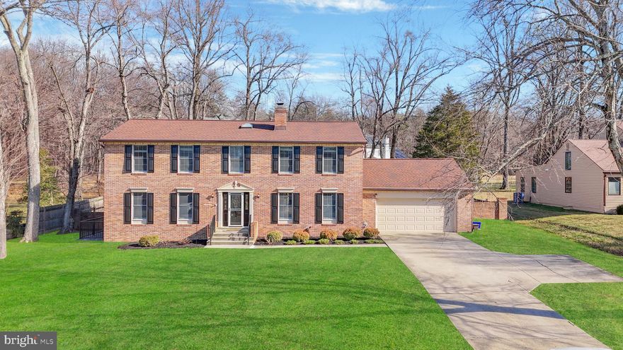 OFFER DEADLINE TUESDAY JANUARY 20th 2026 AT 5 PM. Welcome to 15101 Snowden Drive, a striking brick Colonial that seamlessly blends timeless architecture with refined modern updates. From the moment you arrive, the fresh black shutters and front door, expansive driveway, two-car garage, storm door, and professionally designed landscaping set a powerful first impression—this is a home that commands attention. Inside, a cohesive, designer-curated palette unfolds with fresh paint, new carpet, and wide-plank luxury vinyl flooring throughout the main and lower levels. The foyer welcomes you with warmth and sophistication, opening to a sun-filled formal living room enhanced by recessed lighting and oversized windows. Flow effortlessly into the heart of the home: a show-stopping kitchen designed for both entertaining and everyday living. Quartz countertops with dramatic waterfall edges, custom cabinetry, and a marble herringbone backsplash frame premium stainless-steel appliances, including a commercial-grade Thor six-burner range with statement glass hood, built-in microwave, dishwasher, and upgraded refrigerator with ice maker. Striking black-and-gold pendant lighting and an adjacent breakfast nook complete the space. The dining room connects gracefully to both the kitchen and living room, accented with chair rail molding and an elegant chandelier. The family room offers a cozy retreat with recessed lighting and a white-washed stone hearth surrounding a wood-burning fireplace. A fully renovated main-level bath features a frameless walk-in shower with rainfall and handheld fixtures, sleek black hardware, marble-inspired tile, a beautiful vanity, and a spacious linen closet. The mudroom provides seamless garage access, laundry, built-ins, and outdoor entry. The sunroom is truly exceptional—cathedral ceilings, luxury vinyl flooring, skylights, walls of windows, recessed lighting, dual ceiling fans, French glass doors, and a kitchen pass-through window create an unparalleled indoor-outdoor experience. Step outside to your private backyard oasis featuring a patio, fenced yard, playground, and expansive green space—perfect for entertaining or unwinding. Upstairs, the owner’s retreat offers brand-new carpet, abundant natural light, a ceiling fan, and a walk-in closet with custom organizers. The spa-inspired ensuite bath showcases a frameless glass shower, double quartz vanities, refined black hardware, and elegant tile finishes. Three additional bedrooms, an updated hall bath, and a versatile bonus loft—accessible from both the hallway and owner’s suite—complete the upper level. The walk-up lower level expands your living space with brand-new luxury vinyl flooring, a large recreation area, bonus room, recessed lighting, and ample storage. Additional features include a tankless water heater and sump pump. Enjoy the rare benefit of NO HOA and NO front foot fees, all while being minutes from shopping, dining, libraries, and major commuter routes including Route 200, Route 29, and I-95—offering effortless access throughout the region. Homes of this caliber, location, and condition are rare. 15101 Snowden Drive is move-in ready, lifestyle-driven, and not to be missed. ROOF - 2021;  HVAC (2) - 2019 & 2007; Tankless Gas Water Heater.