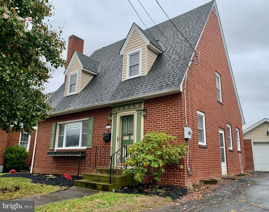 What a gem.  Very well maintained brick home in downtown Romney.  Close to new elementary school.  Many extras. Kitchen boasts beautiful hardwood cabinets. Formal dinning room and living space with brick fireplace for warmth and cozy atmosphere. Spacious Primary bedroom has  walk-in closet and adjacent full bath. Two more spacious bedrooms provide amble room for family or guest room and office.    Make it your own.   Basement is fully finished with carpet, family space, bedroom and full bath. Perfect for extended family or recreation. Full laundry  with washer and dryer. Expansive attic has hardwood floor  to store more than you can imagine.  Off season clothes, holiday decorations, and all your treasures. Backyard is mostly fenced.  Add some panels and will be safe and secure for pets or children.  Shed for garden or yard supplies.  Fire pit adds additional spot for outside fun.  Partially enclosed back porch.  Huge garage.  Two garages back to back offer tons of room for vehicles, storage, lawnmowers, you name it! Being sold "As is". This property has it all for comfortable town living.  Must see to appreciate.  Snag it fast!