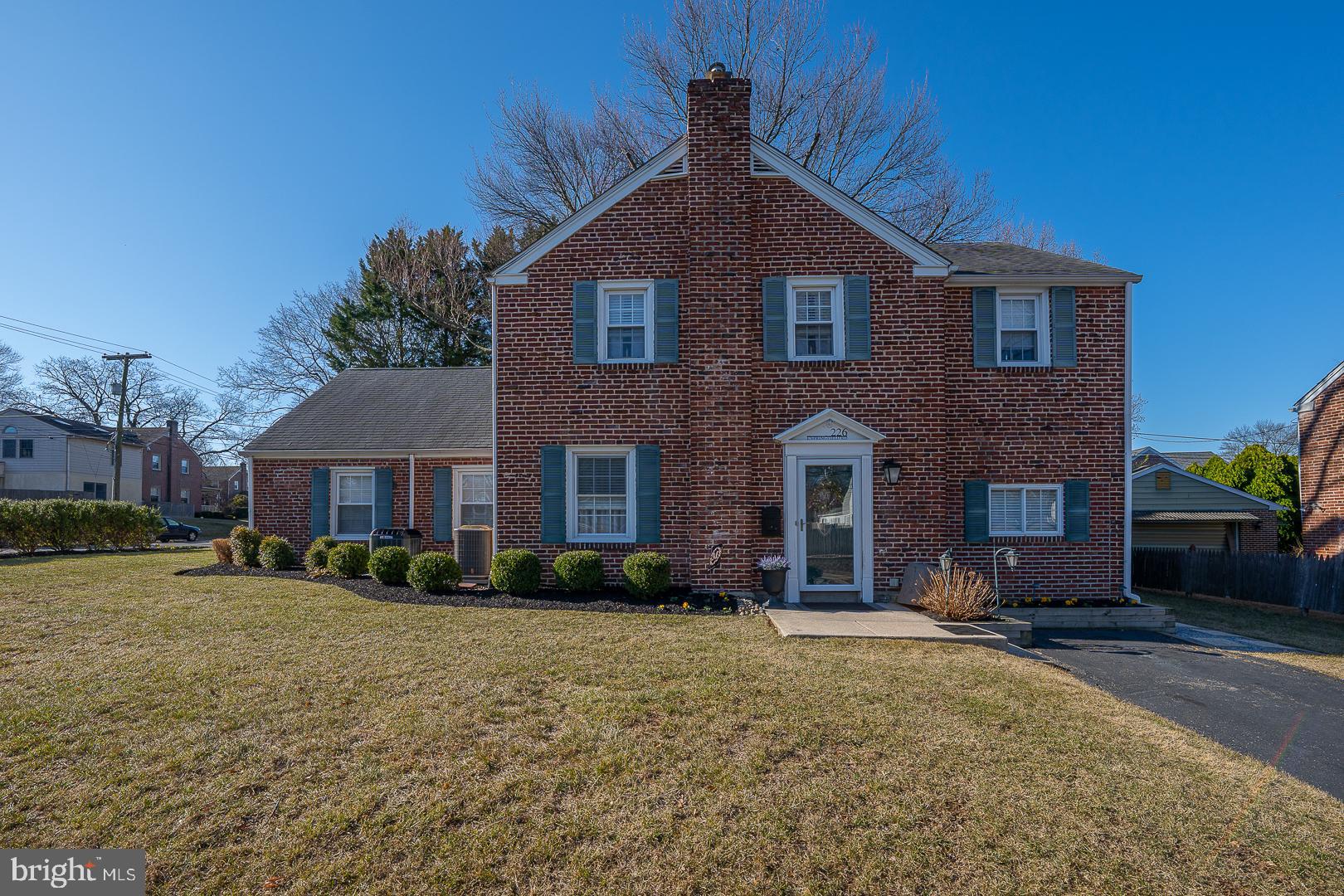 ***NEW PRICE AND FEATURES***
Welcome to 226 E Springfield Road. This well-maintained, 3/4 bedroom, move-in ready, 2-story brick colonial offers a flexible floor plan. The first floor features a living room, formal dining room, a spacious kitchen with eating area, Cherrywood cabinets, granite countertops, breakfast bar, microwave, dishwasher, and refrigerator. The access to the rear patio and yard are off the kitchen, where you'll find beautiful landscaping, edison lighting and a retractable awning over the patio. The yard is ideal for gardening or relaxing.
There is a private entrance on Alford Road leading into a large living space with a full bath, living area, bedroom, adaptable as a guest room, home office, or family room. Or if you prefer this area can become a main bedroom suite with full bath and large walk-in closet. Hardwood floors run throughout the original house, with laundry facilities on both the second floor and lower level. There are 2 private driveways, an oversized 2-car garage with attic storage, and a shed. Located in a top-rated school district, it's minutes from major routes to Philadelphia or Wilmington and walking distance to local amenities.