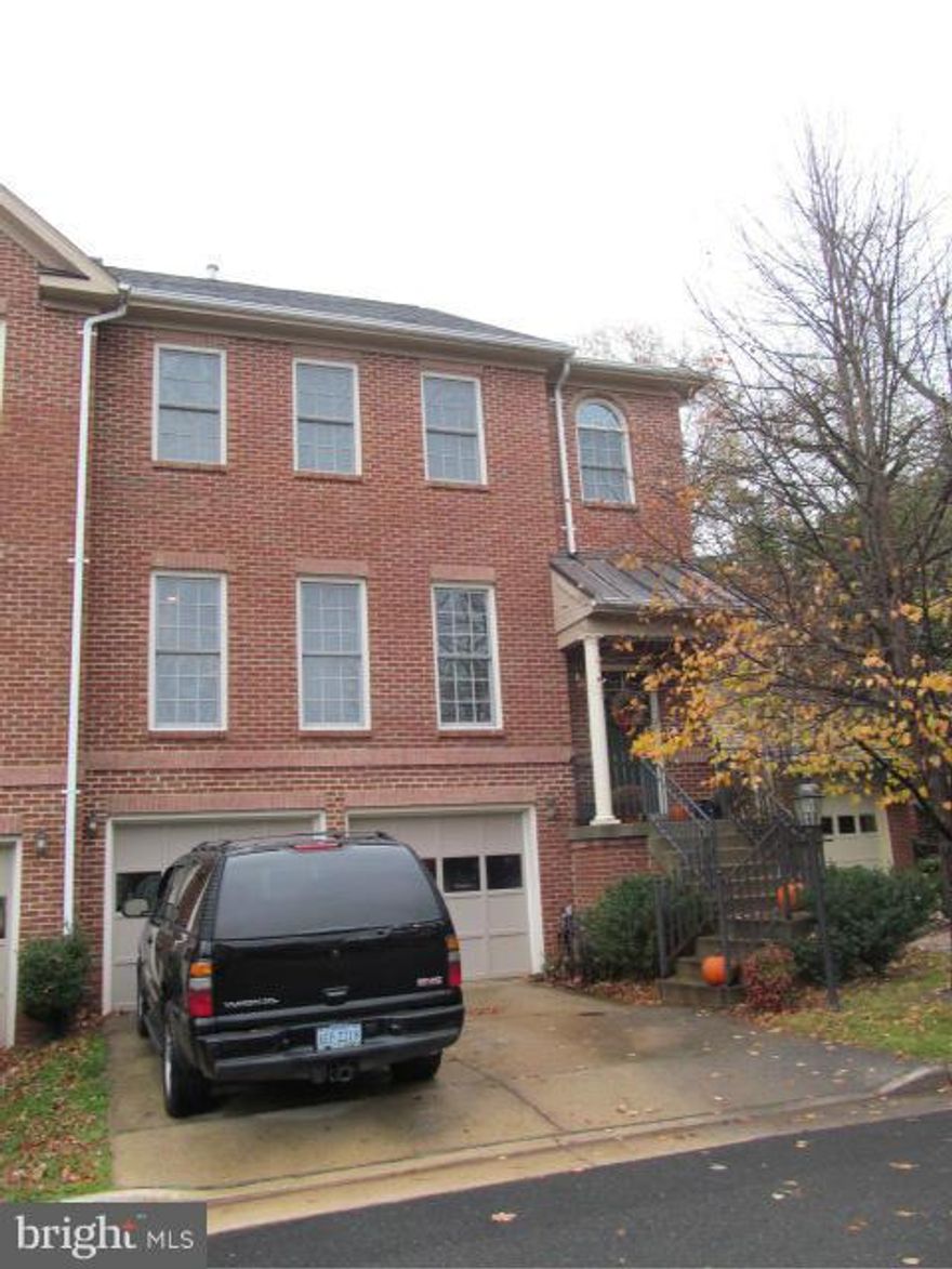 Located in the town of Warrenton this gorgeous three level brick townhouse offers wood floors, columns, crown molding, stainless appliances, Corian countertop,eat in kitchen,  open floor plan, plenty of sun light, formal dining room, living room with fireplace, upper level with 3 BR's and 2 Full Baths, basement with family room & garage. Deck out back for grilling!