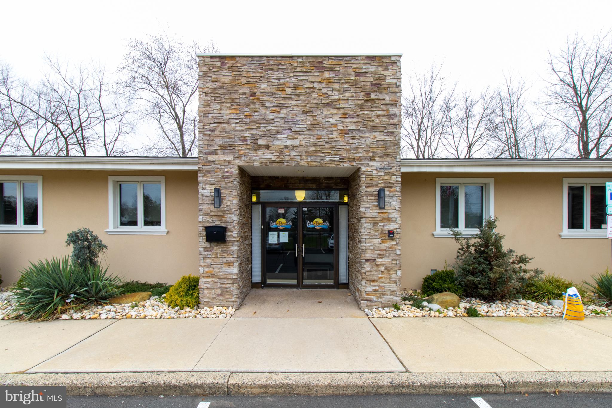 Approximately 9,764 square feet of space situated on 1.07 acres in Middletown Township, Bucks County, PA. This property has undergone a condominium conversion, creating two distinct spaces: Unit I and Unit II.
**CONDO Unit I: 16 Bed Inpatient Residential Detox Facility. This is a licensed turnkey opportunity, including the furnishings and equipment currently in place. Licensed since 2020, the Detox Faclity occupies approximately 5,000 square feet across an upper and lower level connected by an internal stairway and elevator. Other use could include Inpatient Mental Health Rehabilitation.
Upper Level:
16 Beds, 8 rooms, each featuring private baths and showers, dual televisions, and individual room temperature controls and electric adjustable beds. Two beds are located in a fully wheelchair accessible unit with a fully compliant shower. Completing this level is a registration office and a 360 degree nurses station with a secure medication room, 1 medical office with handwashing sink and a seperate half bath complete this floor.
Lower Level
The lower level is accessible by elevator or a wide staircase. Included on this level are the Kitchen and Dining Areas, a Media room / Group room. A private office / snack room, fully equipped laundry room and two luxurious spa rooms with hot or cold soaking tubs. Each spa room features a full bath with shower and heated towel racks. One half bath completes this level.
CONDO Unit II This unit, spanning approximately 5,000 square feet, is currently licensed as an outpatient drug and alcohol facility. Entitlements with Middletown Township, Bucks County include zoning and construction documents approvals, that allow conversion of this Condo for use as 16-bed inpatient Residential Detox Facility or as an Inpatient Mental Health Rehabilitation facility.
Exterior:
The rear area of the property features a gazebo / smoking area and general recreation space.
The property is fenced with an electrically operated gate. The large parking lot easily supports these uses.