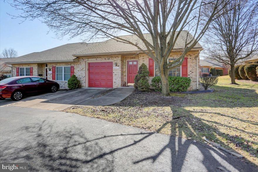 Enjoy Care free living in Hagerstown's only gated community! This solid end unit Condo sits nicely tucked away in a cul-de-sac within close proximity to the Community Clubhouse. It offers an open floor plan with a spacious living room/ dining room area with a good sized kitchen offering plenty of cabinetry and  countertop space, There's a  separate laundry room  off the garage and 2 bedrooms in the back of the home with a great covered patio in the rear. Has an attached single garage with pull down stairs for additional storage. New Central air unit installed August 2023 (10k) and hot water heater 2 years ago. Great central location close to all amenities. HOA covers snow trash, grass care, exterior maintenance and use of Clubhouse.