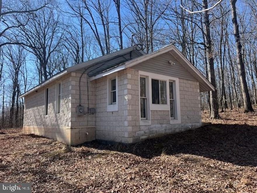 Solid as a rock and twice as cozy ! This 2/1 block home is really a great home ! Built in 2009 and never lived in full-time this as close as you'll get to brand new construction without the hefty price tag that comes with a new build. This home is in immaculate condition and would make a great starter home, retirement property, airbnb or part-time weekend getaway ! Sale also includes an extra lot for additional privacy to sweeten the pot !Both lots 6A containing 3 acres and lots 6B containing 2 acres are included with the sale and most furnishings will convey as well so what are you waiting for ? He who hesitates has lost a real gem !!!