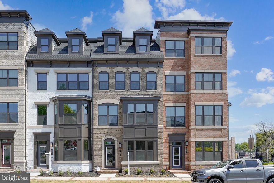 Welcome to this beautifully appointed luxury townhouse offering the perfect blend of comfort, style, and location. Featuring a spacious 2-car garage with automatic openers, this home is designed for modern living. The main level includes a versatile office or guest room paired with a full bathroom — ideal for remote work or hosting visitors. The first upper level boasts a bright, open floor plan with gleaming hardwood floors throughout. The gourmet kitchen is a chef’s dream, showcasing stainless steel appliances, a massive center island, and custom cabinetry. Enjoy seamless indoor-outdoor living with a large private terrace just off the dining area, complete with a cozy gas fireplace — perfect for entertaining year-round. 
The luxurious primary suite offers a walk-in closet with built-in organizers and a spa-like en-suite bath. A top-level loft/flex room features its own full bath and opens to a second private balcony, offering additional living or guest space. Located just minutes from the Town of Vienna, with easy access to shops, restaurants, and the W&OD trail, this home truly has it all. Don't miss this rare opportunity — a must-see! Available July 10th.