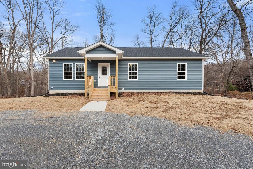 HERE'S YOUR CHANCE! Previous contract fell through due to buyer's financing. Their loss is your gain! Escape to your mountain retreat! This brand new rancher nestled on 0.84 acre and quiet cul-de-sac, grants Shenandoah River access for all your favorite water activities. Upon entering you'll be amazed by the striking cathedral ceiling with an abundance of recessed lighting, chair rail, and luxury vinyl plank flooring. The open layout seamlessly connects the living area to the dining space and upgraded kitchen boasting granite counters, soft-close doors and cabinets. The window above the deep, inset sink offers a scenic view of the wooded rear lot. A full bathroom in the partially finished basement and additional space for rooms invites the possibility of an in-law suite. A spacious den opens to the rear patio for effortless entertaining. Abundant unfinished space ensures ample storage, and high-speed internet is available for connectivity. Your retreat awaits! Choose your own appliances with the $2,500 appliance allowance from the builder.